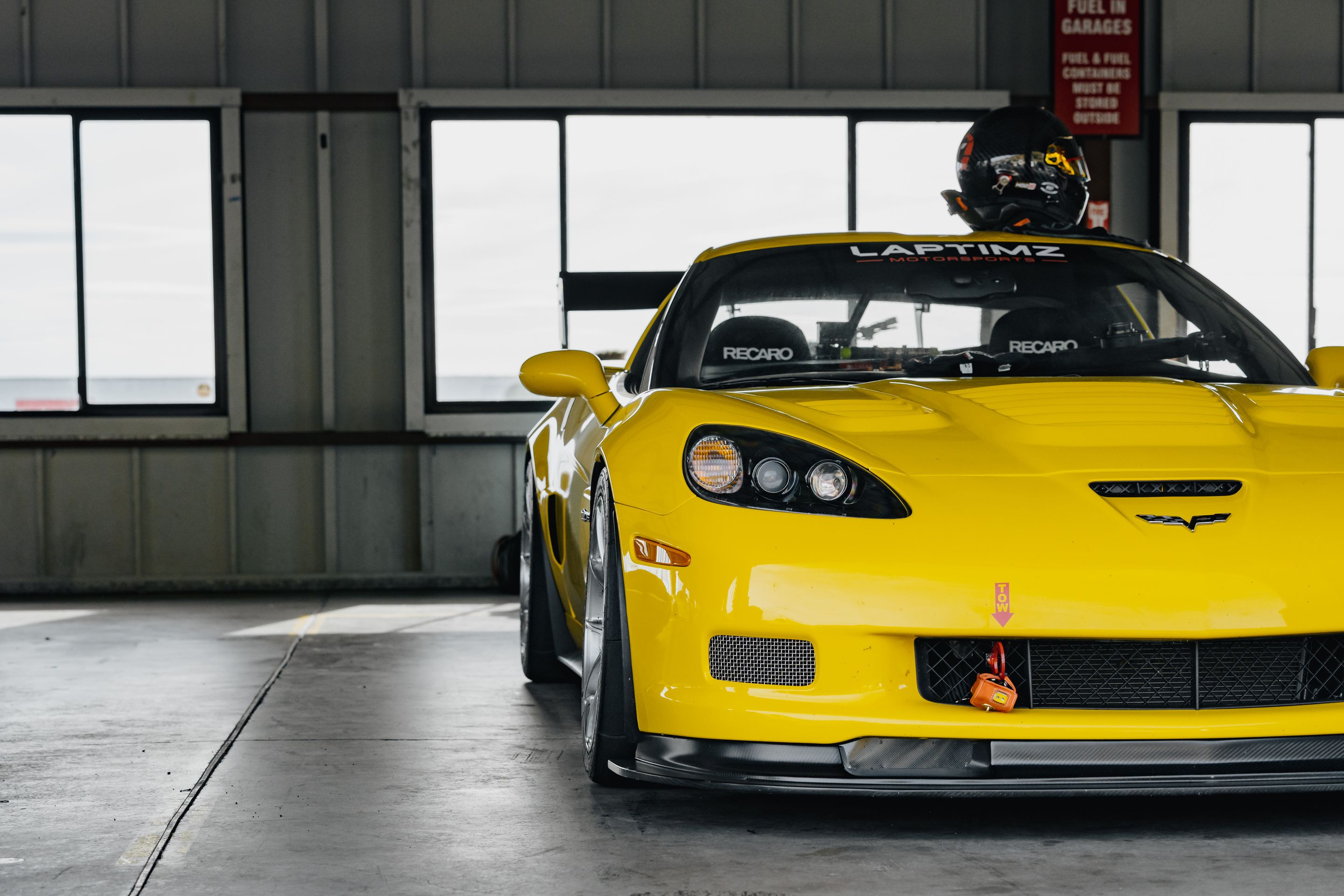 Yellow Chevrolet C6 Corvette Z06 with 18" VS-5RS Apex wheels in Brushed Clear