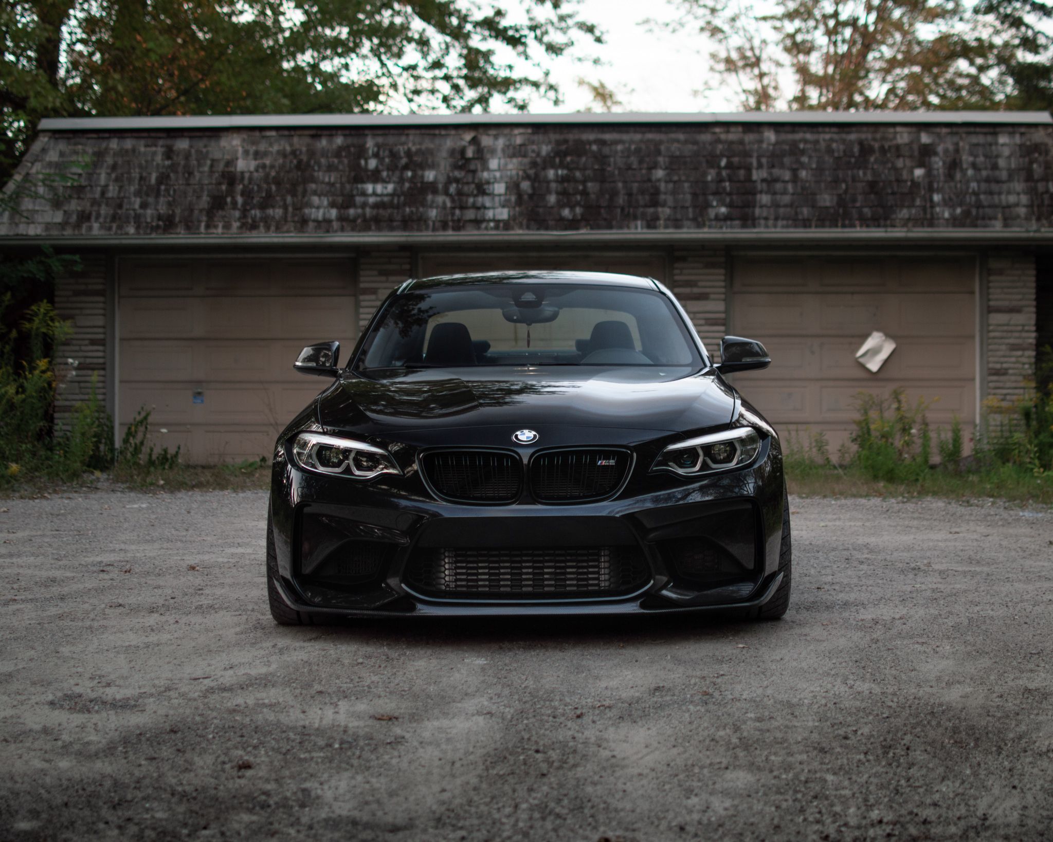 Black BMW F87 M2 with 18" SM-10 Apex wheels in Race Silver