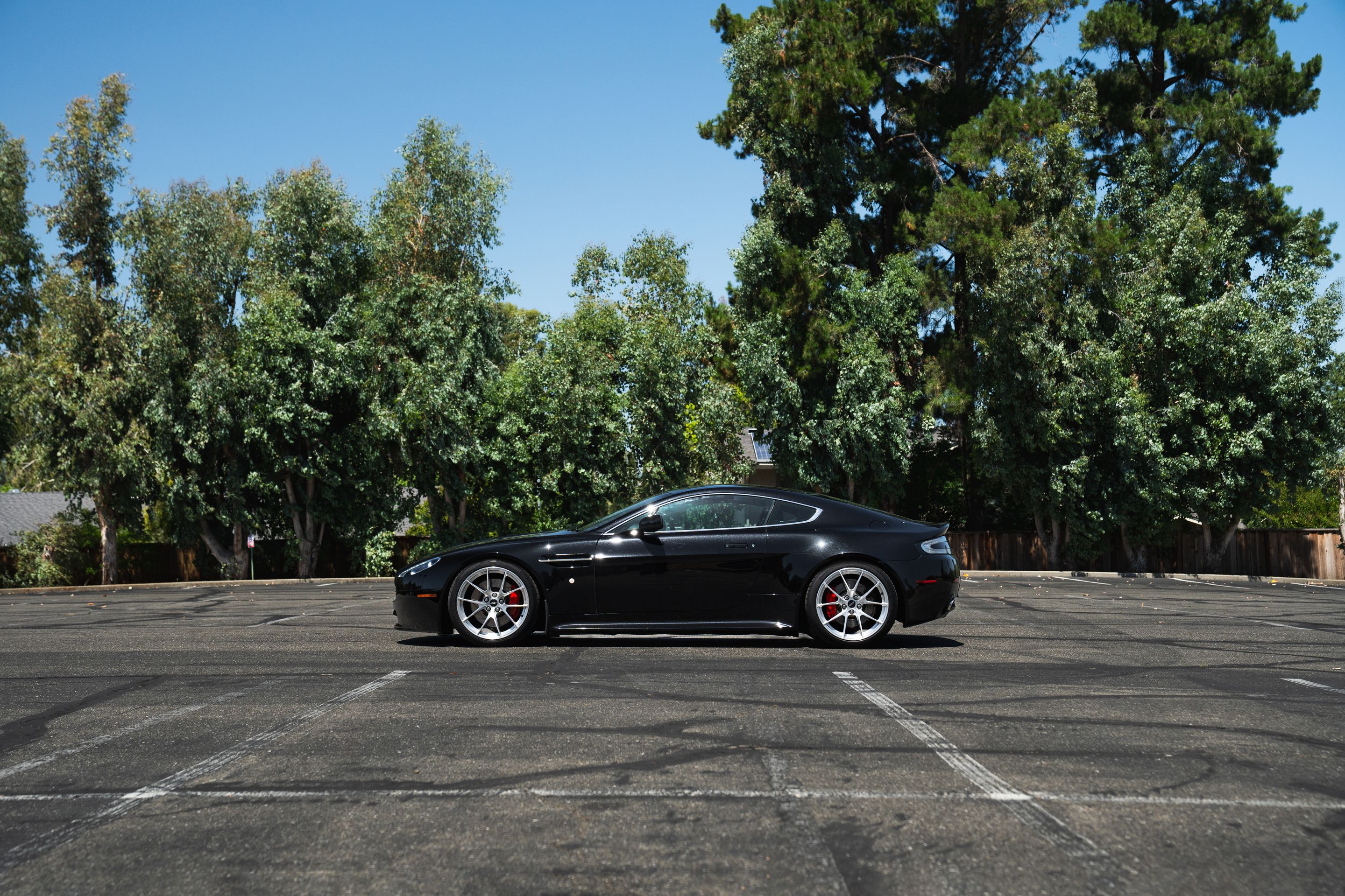 Black Aston Martin V8/V12 Vantage with 19" VS-5RS Apex wheels in Brushed Clear