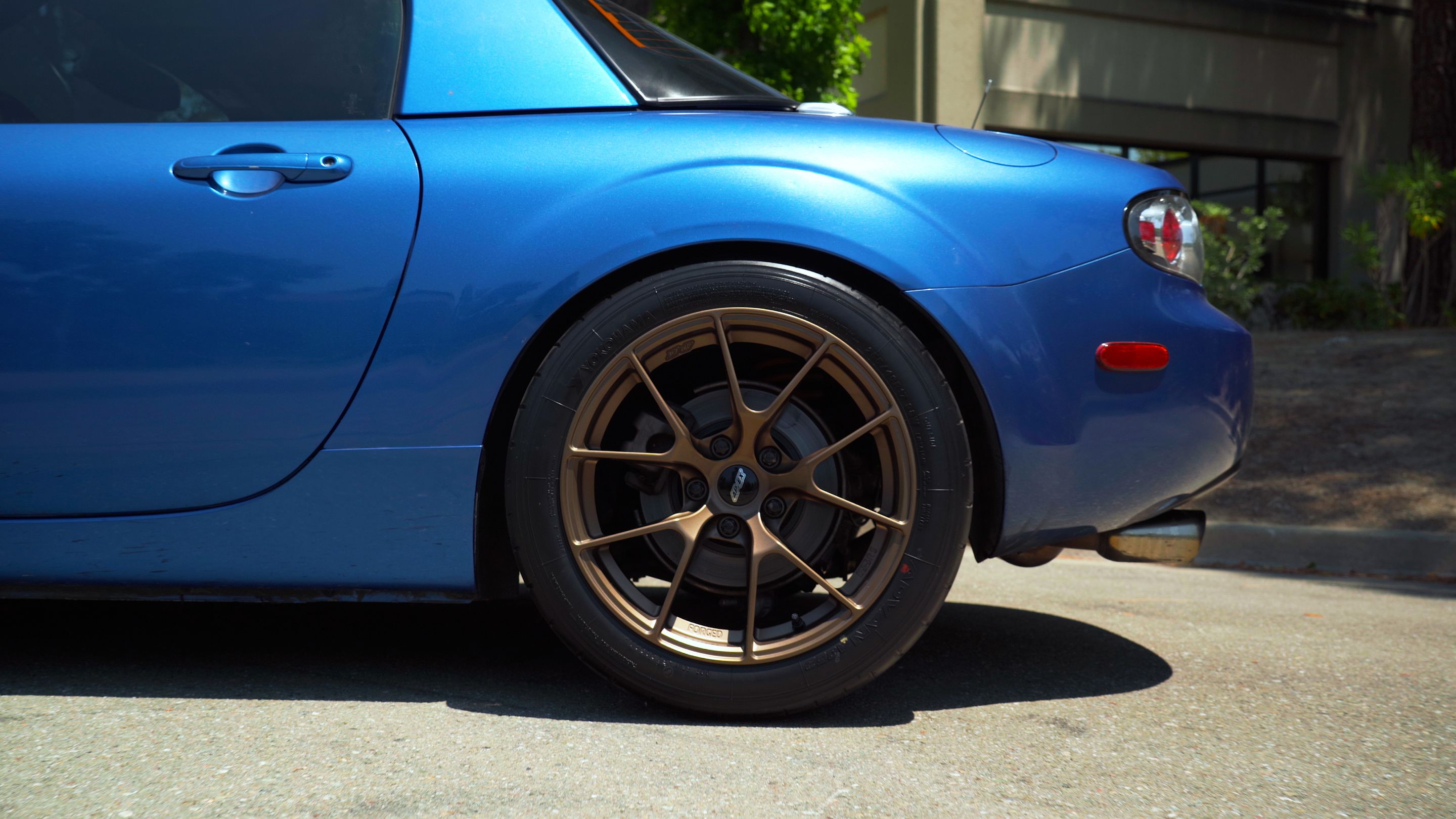 Blue Mazda NC MX-5 Miata with 17" VS-5RS Apex wheels in Satin Bronze