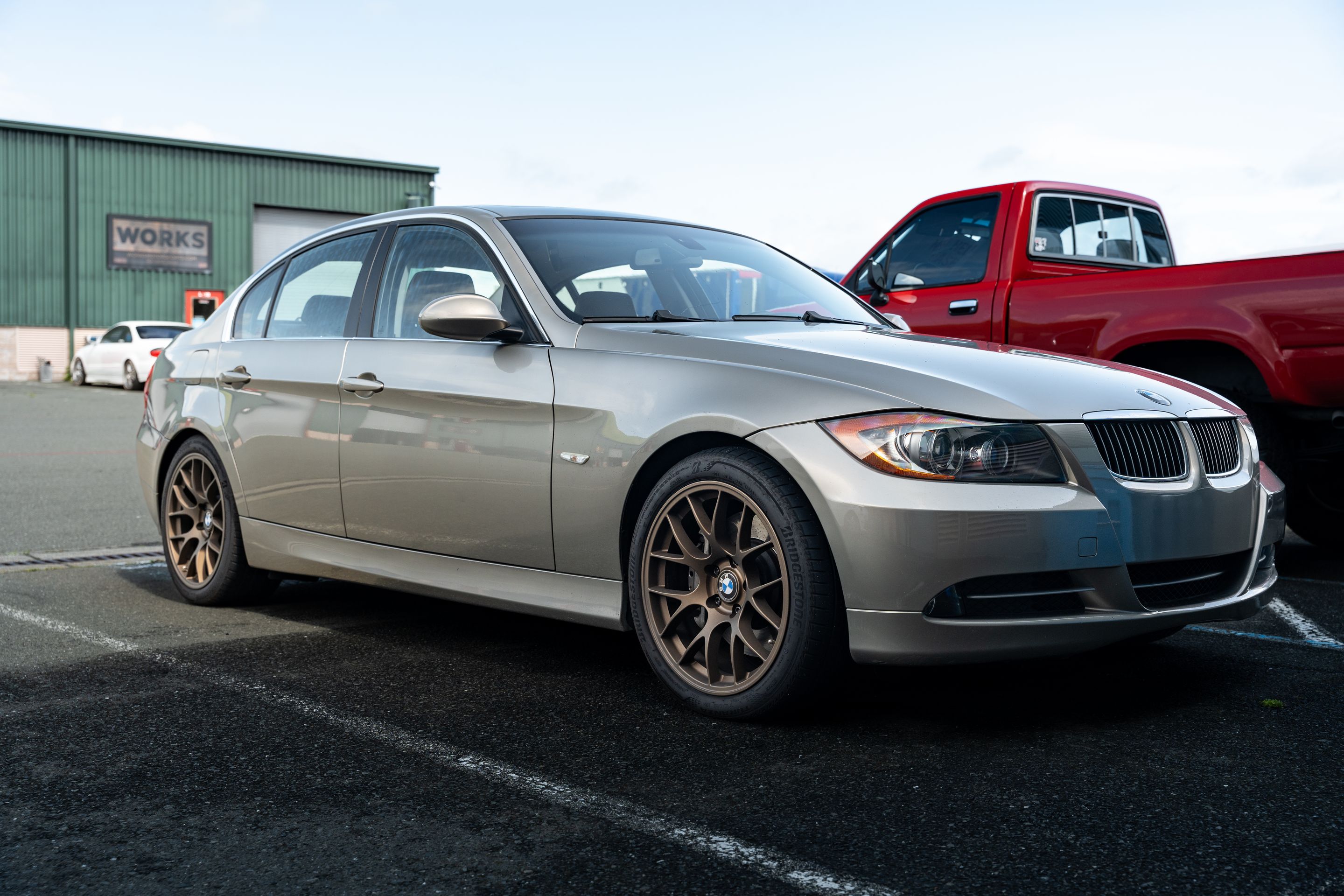 Silver BMW E90 Sedan 3 Series with 18" EC-7 Apex wheels in Satin Bronze