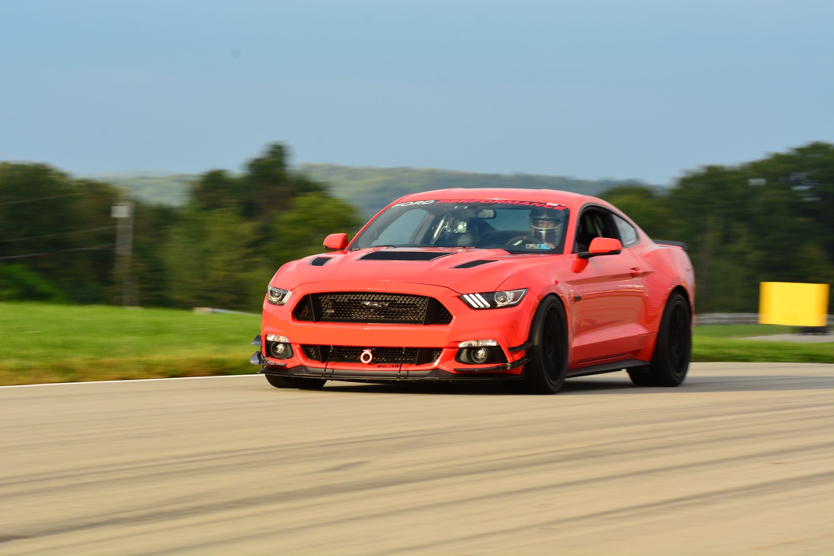 Orange Ford S550 Mustang GT with 19" EC-7 Apex wheels in Satin Black