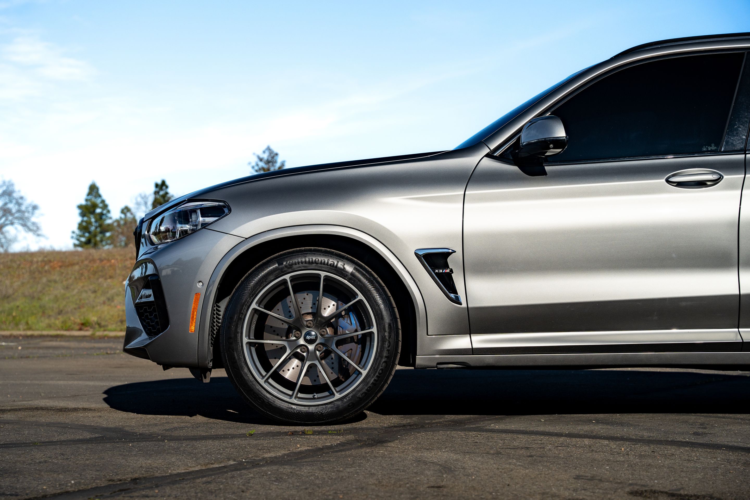 Silver BMW F97 X3M with 20" VS-5RX Apex wheels in Anthracite