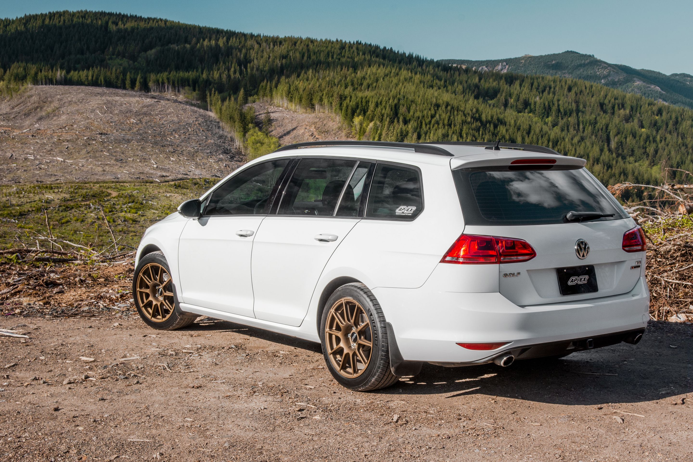 White VW MK7 Alltrack/SportWagen Golf SportWagen with 17" SM-10 Apex wheels in Satin Bronze