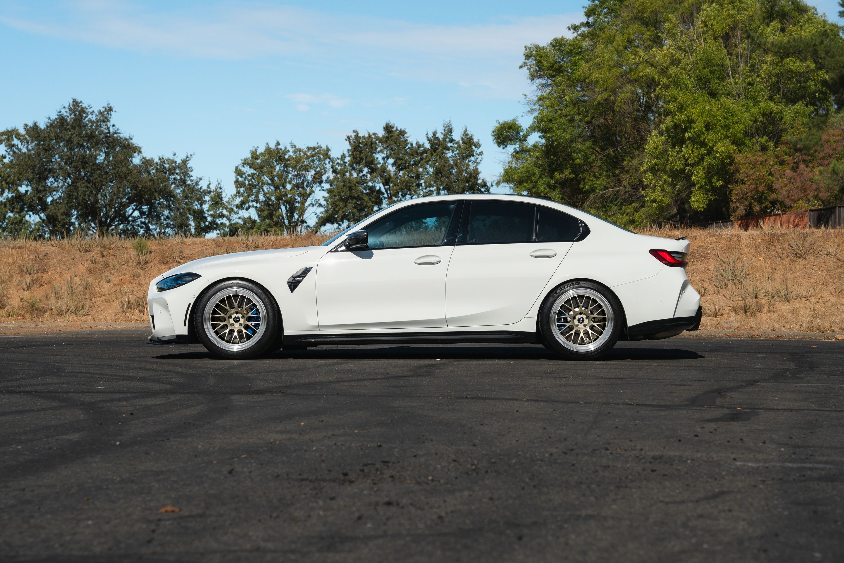 White BMW G80 M3 with 19" ML-10RT Apex wheels in Machined Lip Gloss Motorsport Gold