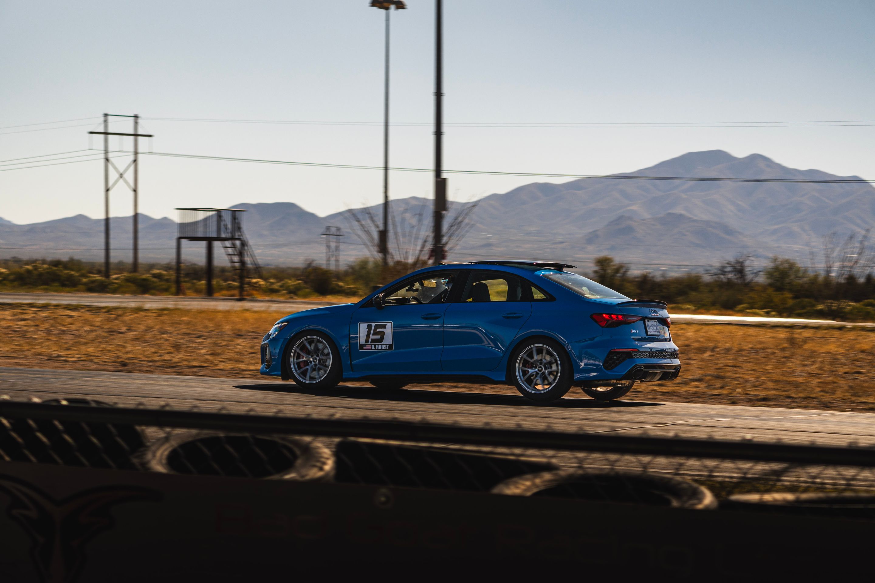 Blue Audi 8Y RS 3 with 18" VS-5RS Apex wheels in Brushed Clear