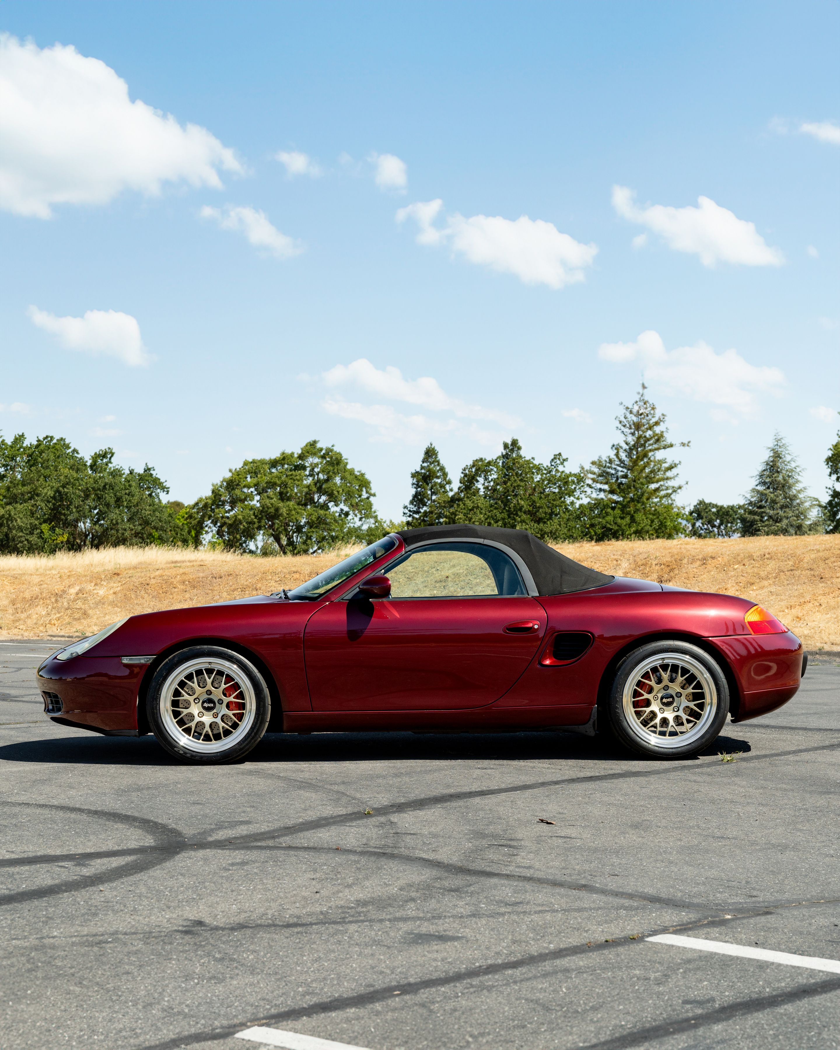 Red Porsche 986 Boxster with 18" ML-10RT Apex wheels in Machined Lip Gloss Motorsport Gold