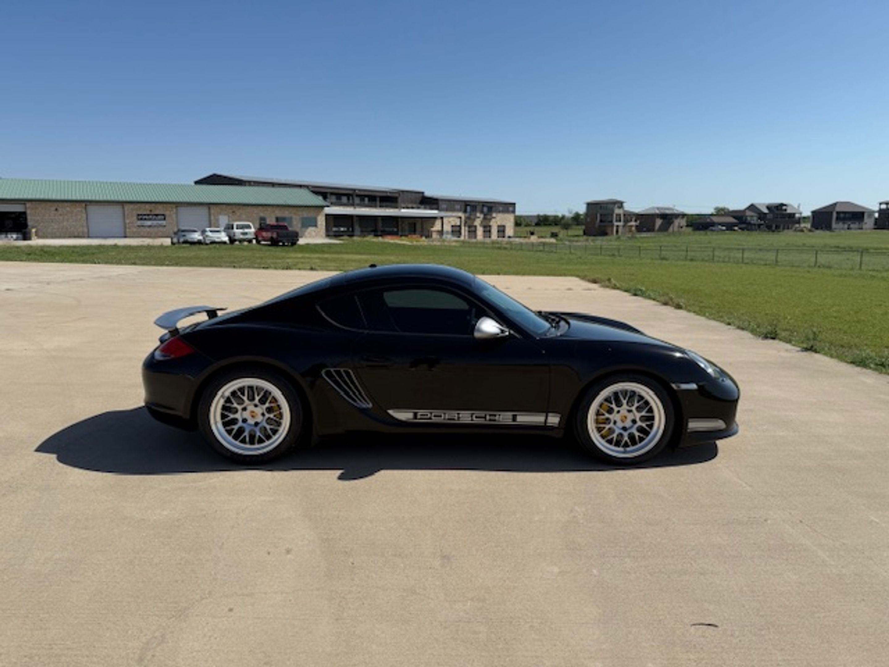 Black Porsche 987 Cayman R with 18" ML-10RT Apex wheels in Machined Lip Race Silver
