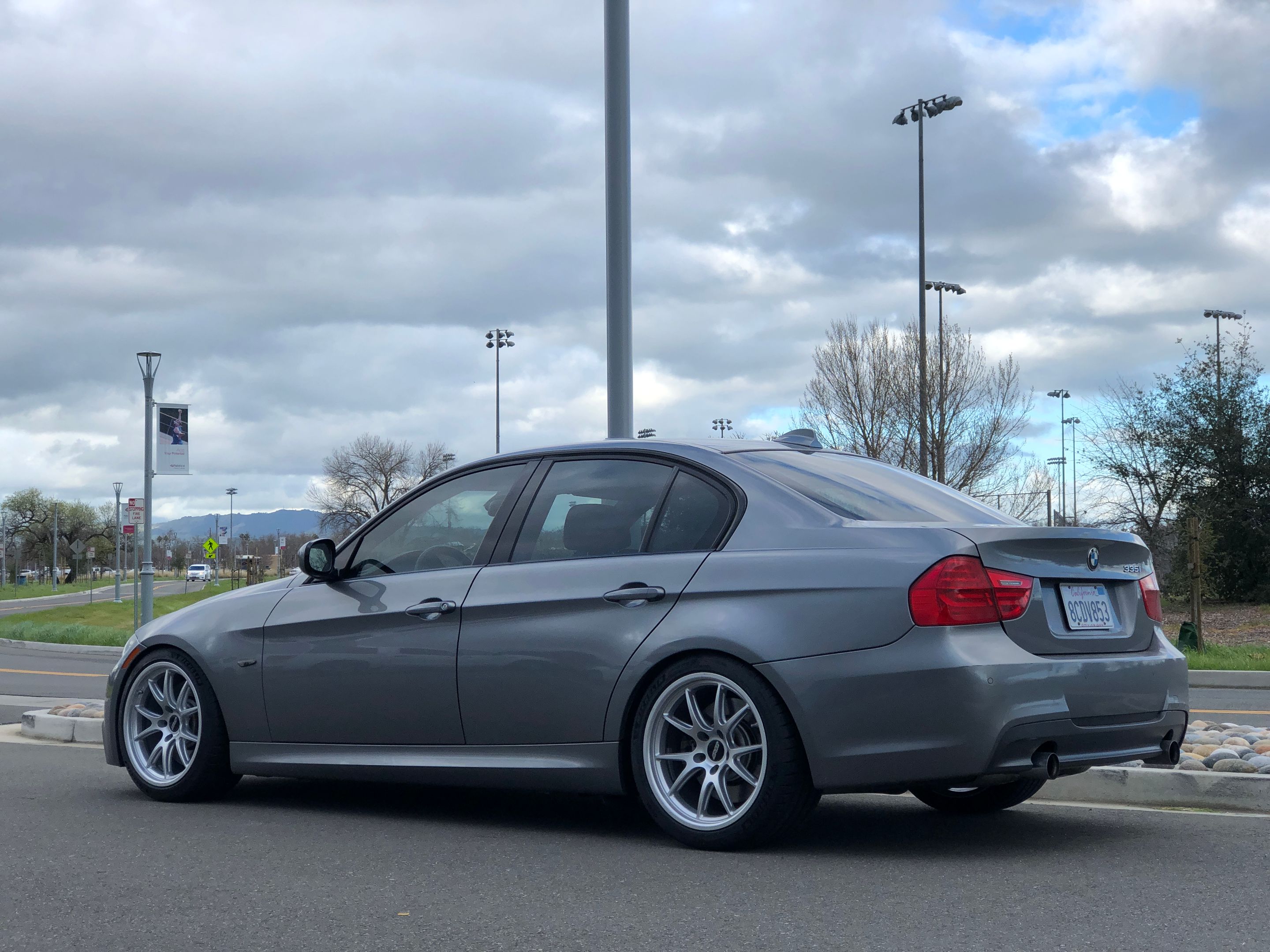 Grey BMW E90 LCI Sedan 3 Series with 18" FL-5 Apex wheels in Race Silver