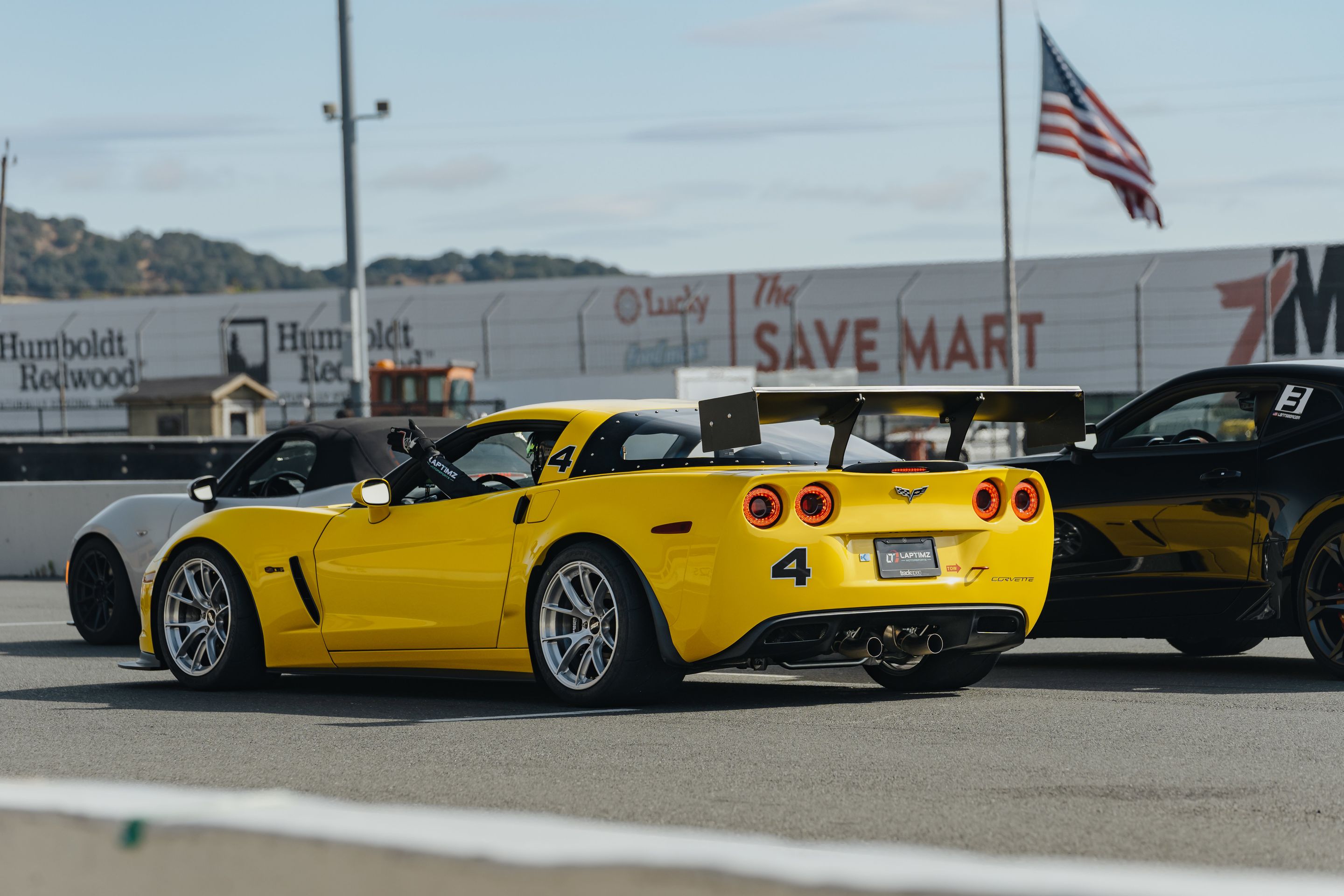 Yellow Chevrolet C6 Corvette Z06 with 18" VS-5RS Apex wheels in Brushed Clear