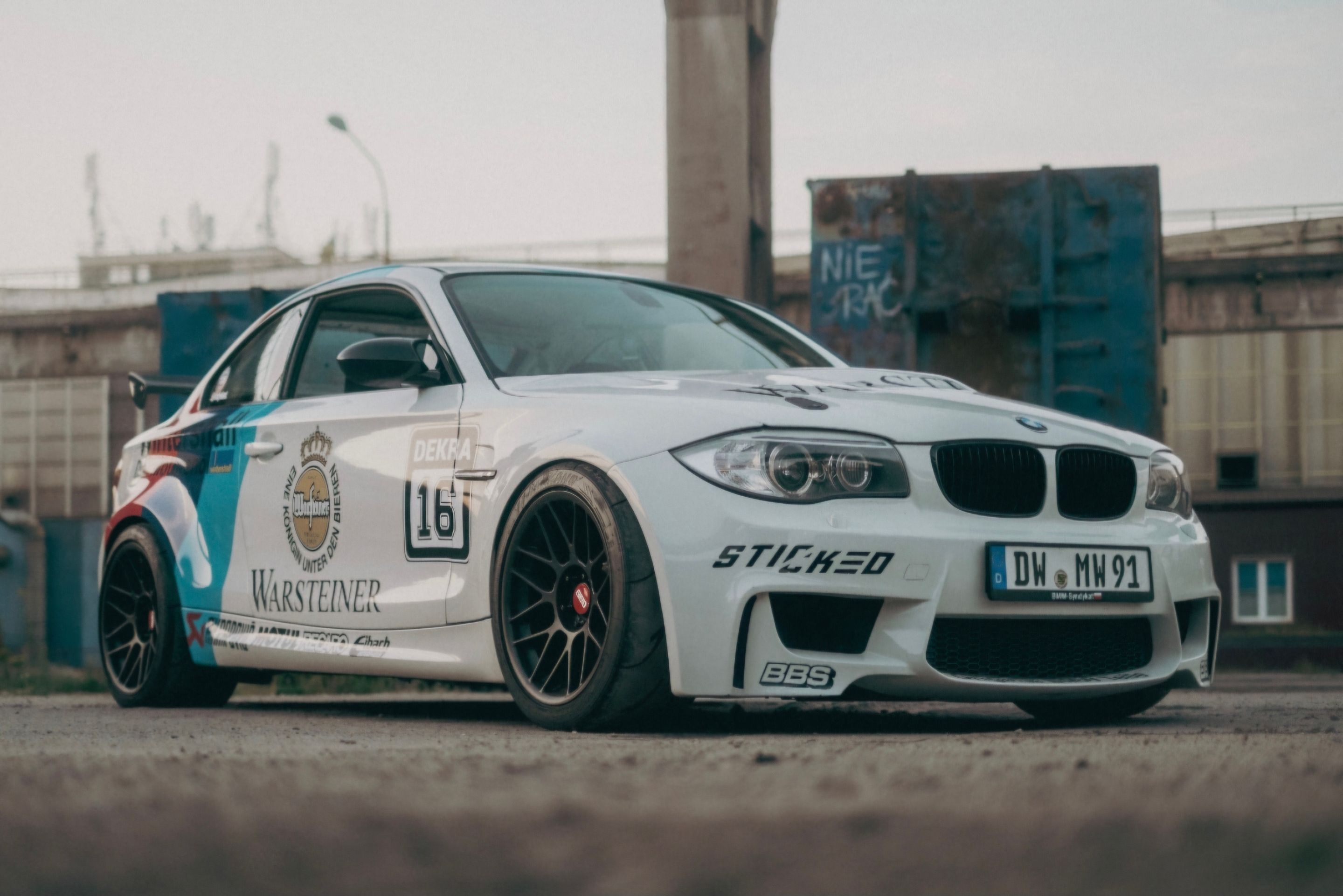 White BMW E82 1M with 18" ARC-8 Apex wheels in Satin Black