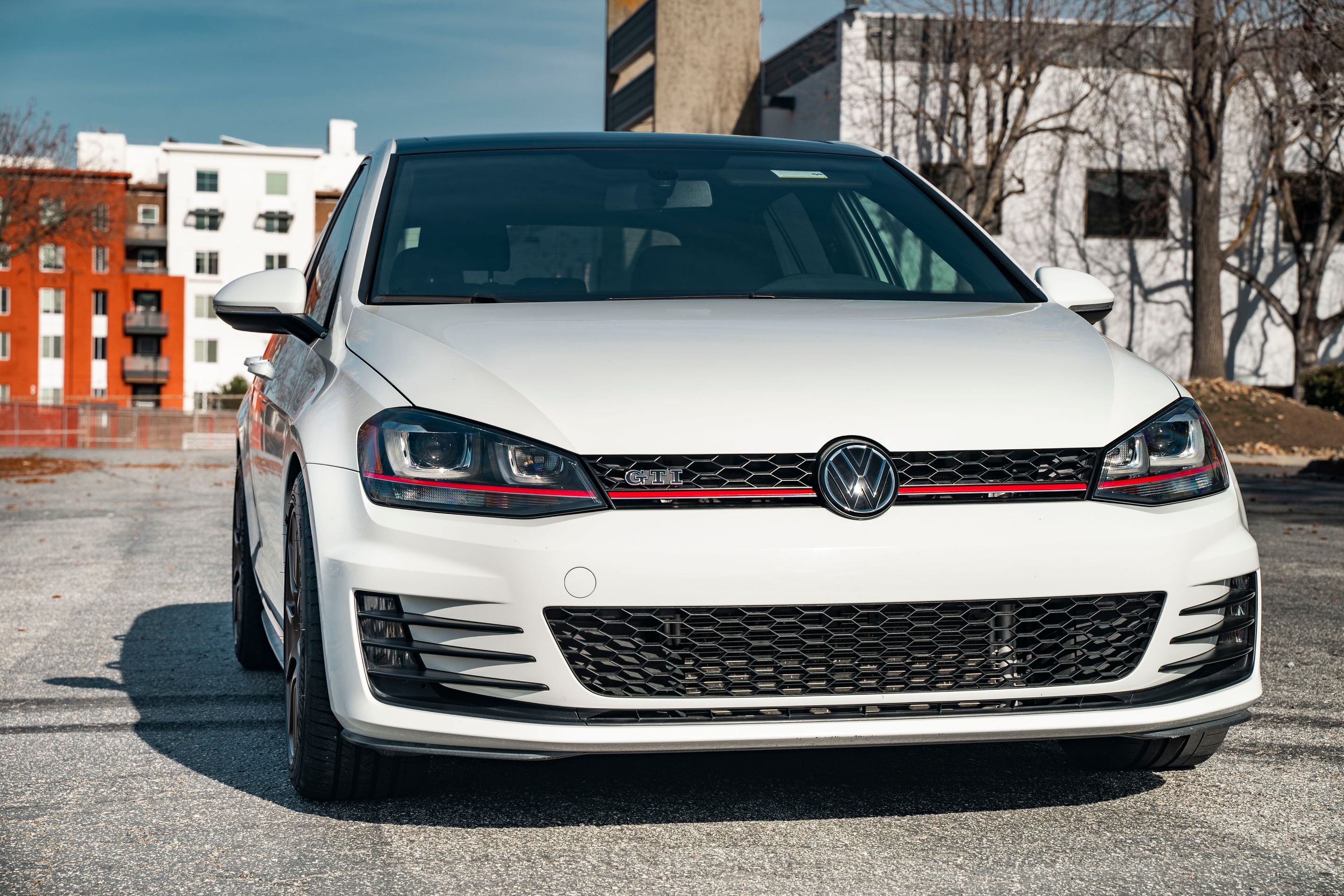 White VW MK7 GTI with 17" SM-10 Apex wheels in Satin Bronze