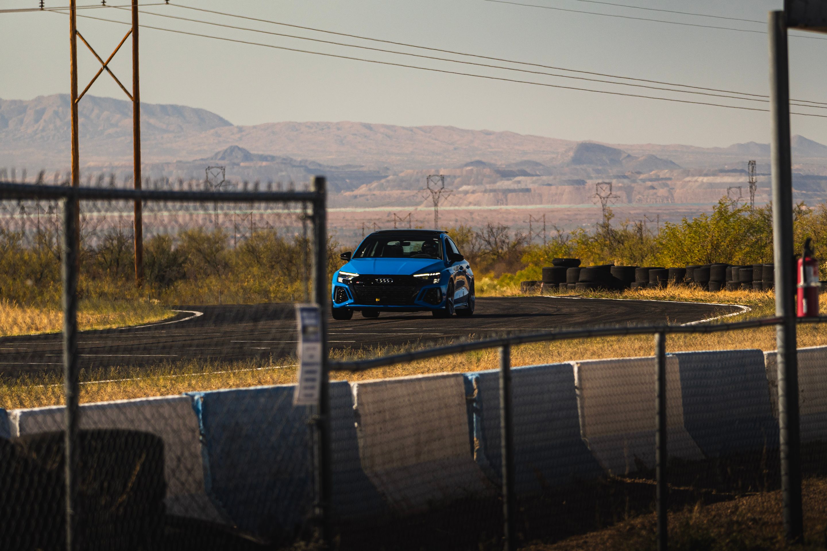 Blue Audi 8Y RS 3 with 18" VS-5RS Apex wheels in Brushed Clear
