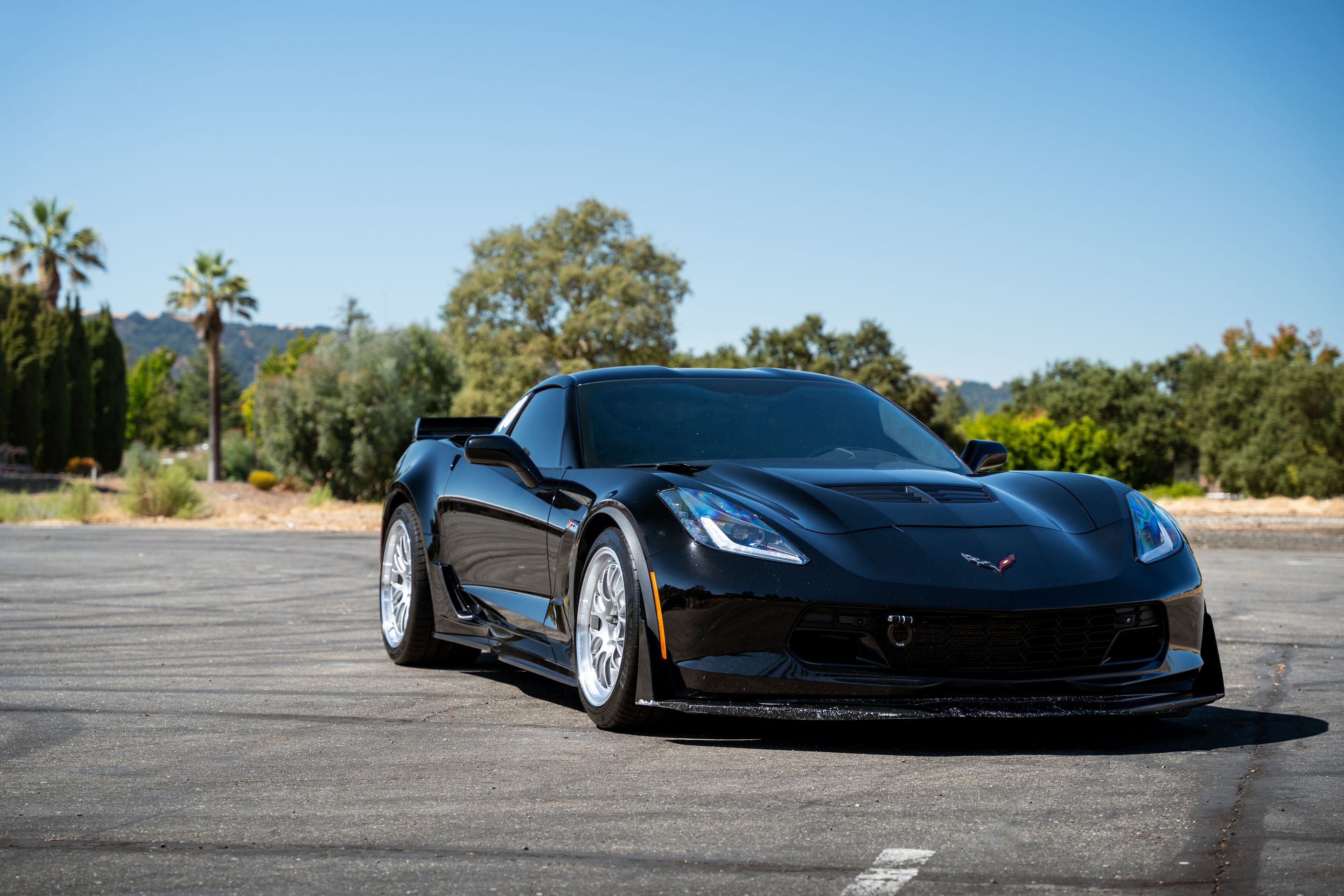 Black Chevrolet C7 Corvette Z06 with 18"/19" ML-10RT Apex wheels in Machined Lip Race Silver