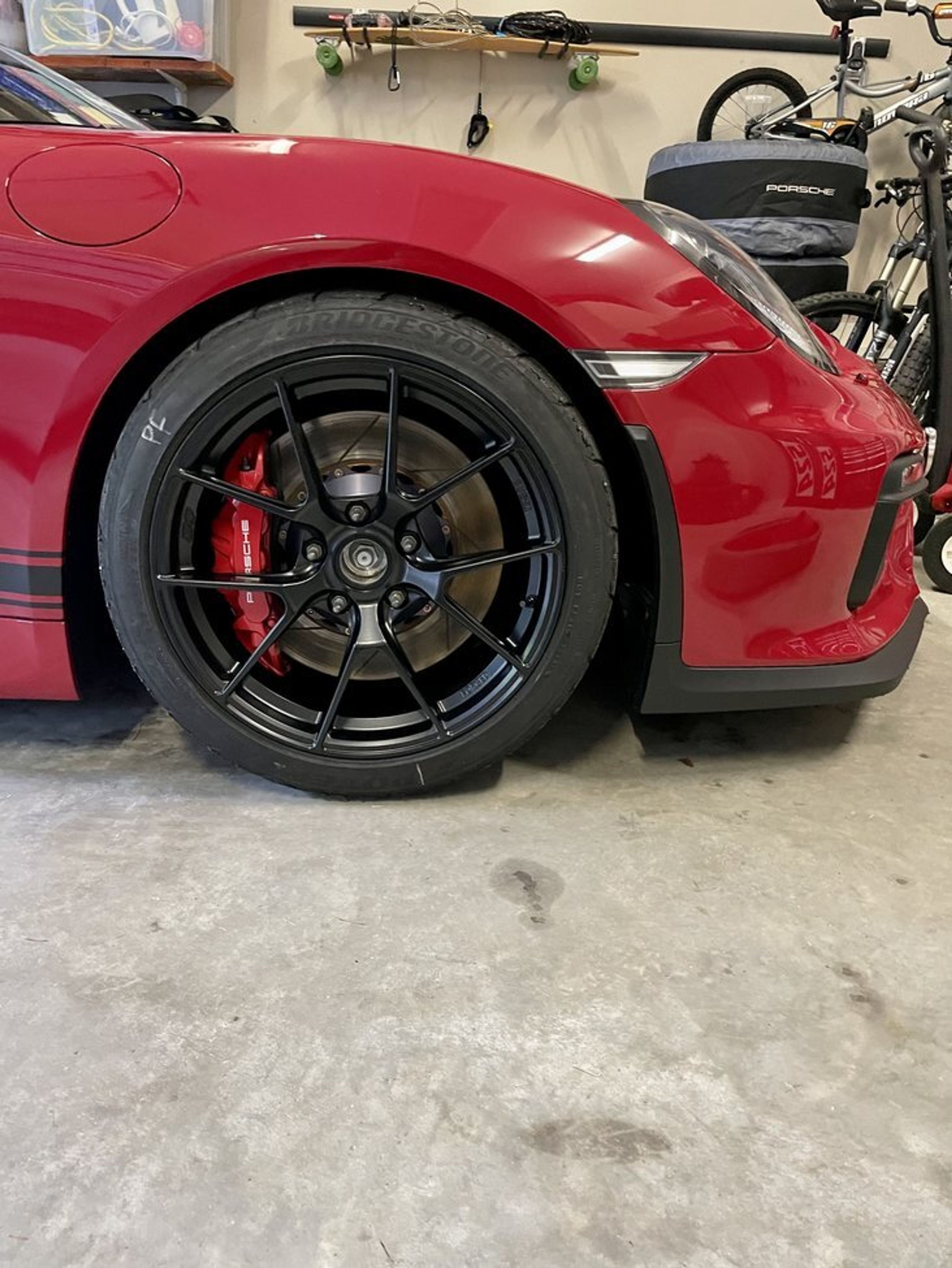 Red Porsche 981 Cayman GT4 with 19" VS-5RS Apex wheels in Satin Black