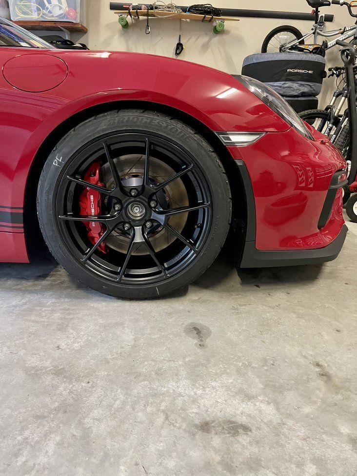 Red Porsche 981 Cayman GT4 with 19" VS-5RS Apex wheels in Satin Black