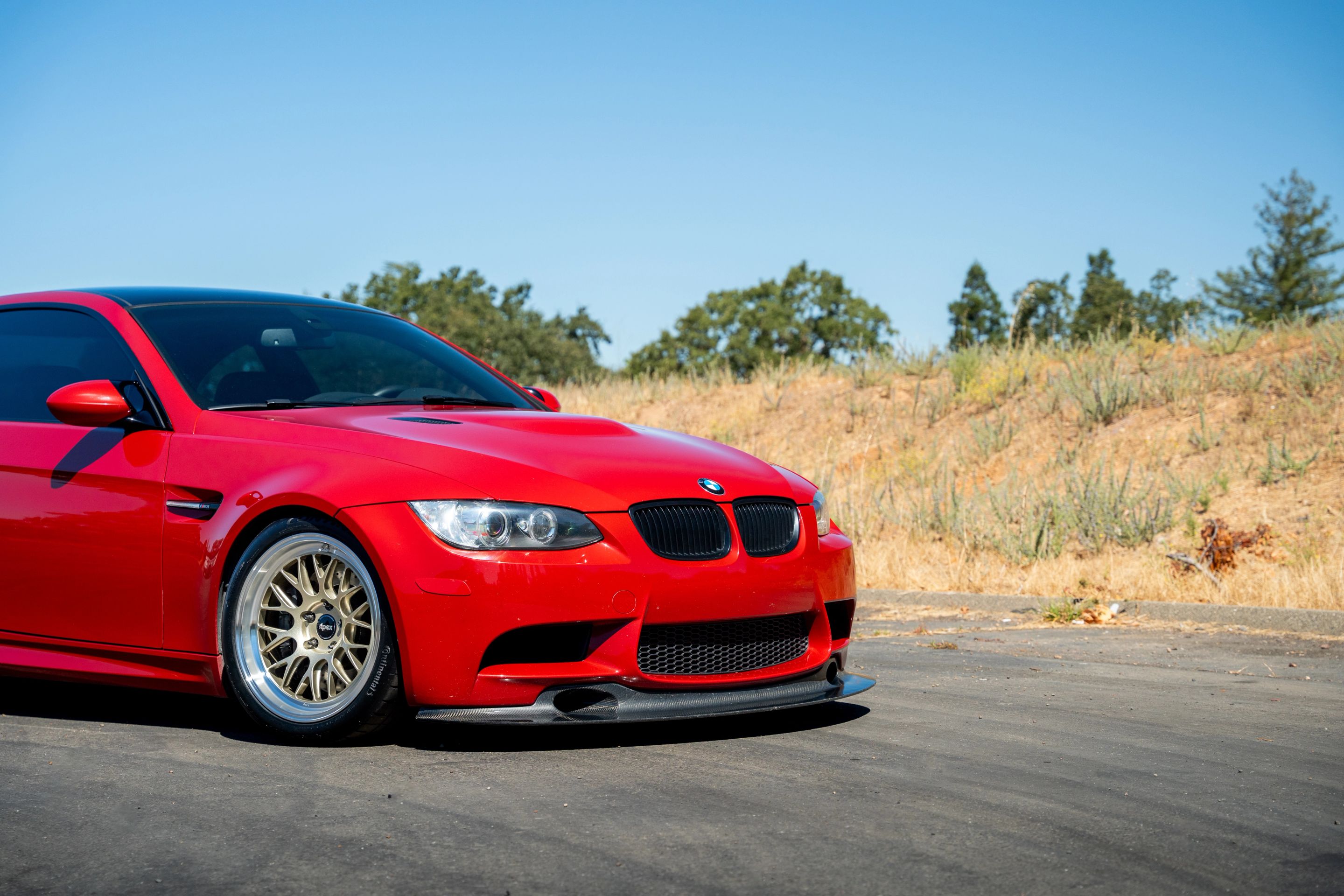 Red BMW E92 Coupe M3 with 18" ML-10RT Apex wheels in Machined Lip Gloss Motorsport Gold