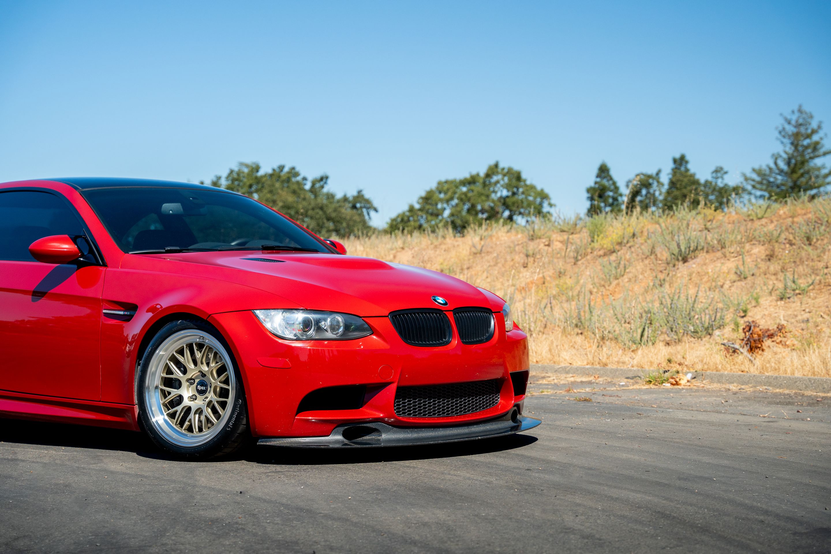 Red BMW E92 Coupe M3 with 18" ML-10RT Apex wheels in Machined Lip Gloss Motorsport Gold