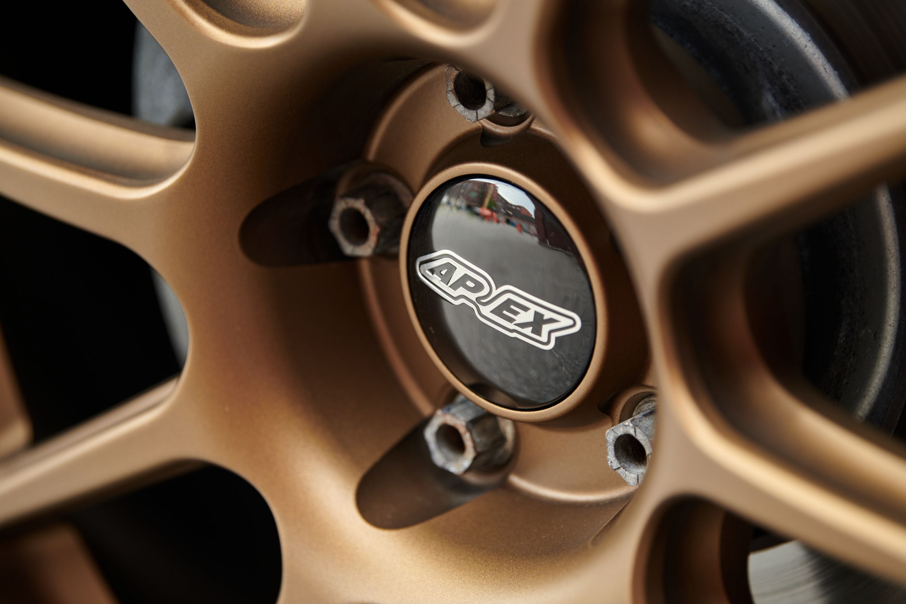 Red VW MK7 Alltrack/SportWagen Alltrack with 18" SM-10 Apex wheels in Satin Bronze