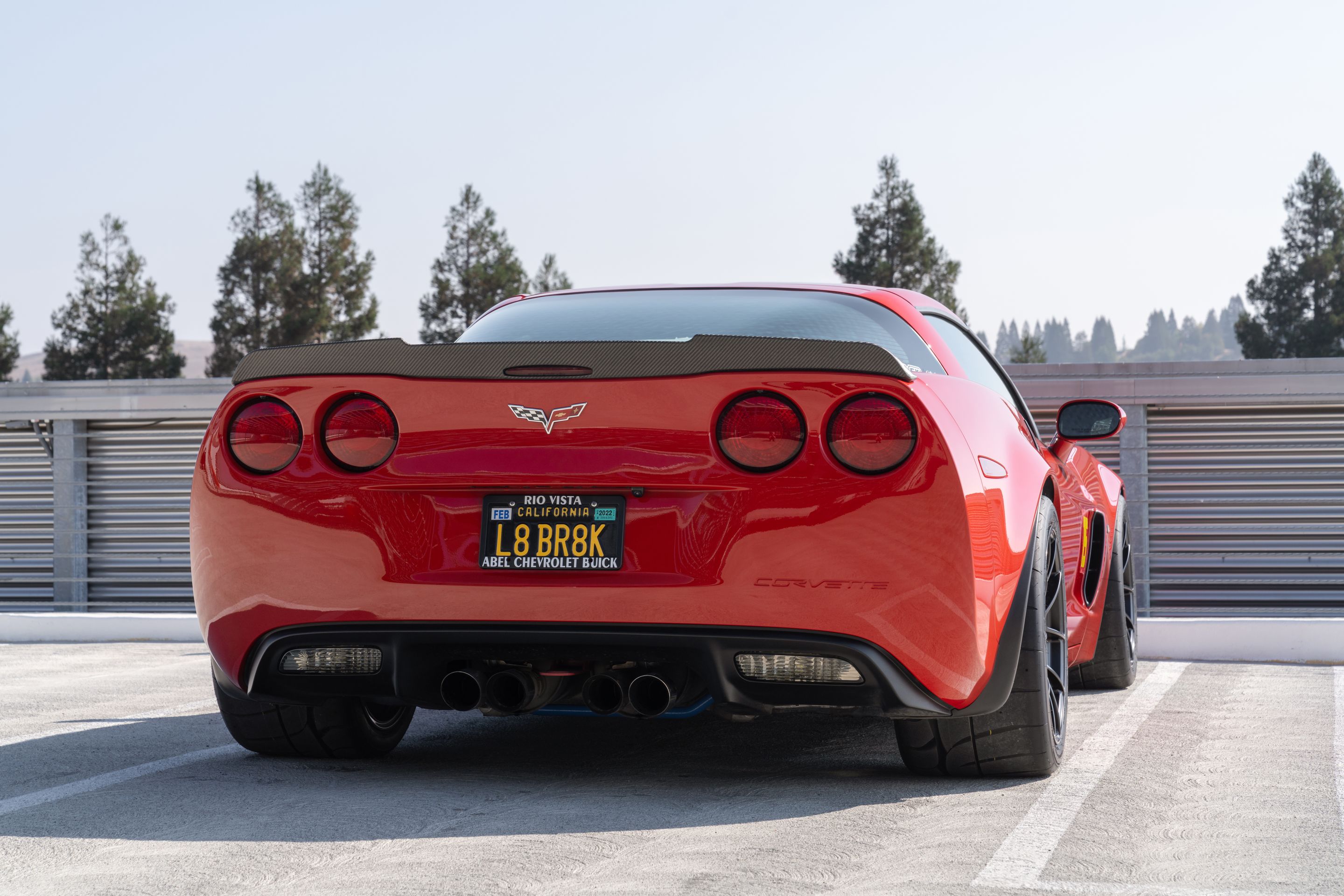Red Chevrolet C6 Corvette Z06 with 18" VS-5RS Apex wheels in Satin Black