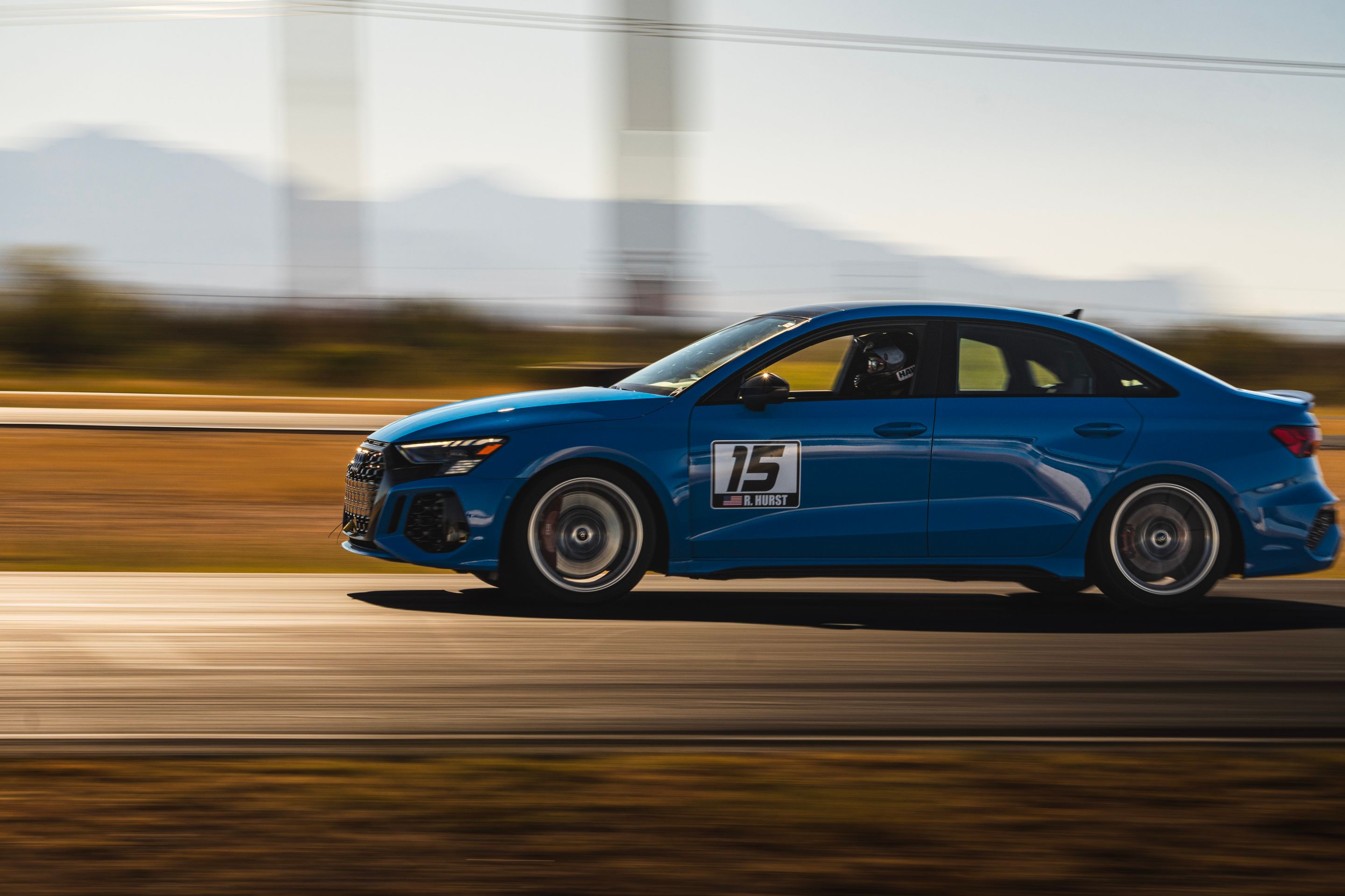 Blue Audi 8Y RS 3 with 18" VS-5RS Apex wheels in Brushed Clear