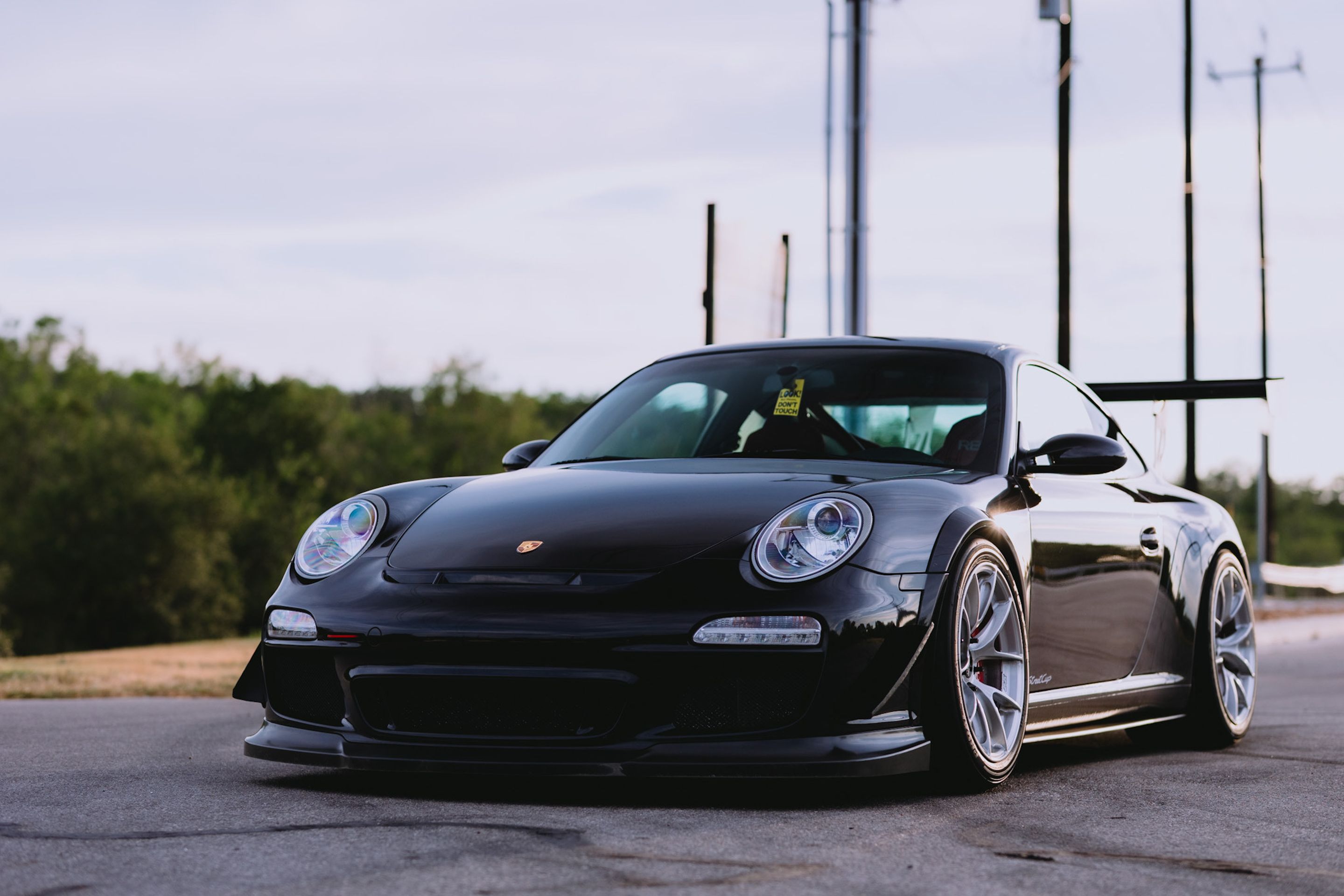 Black Porsche 911 997 Carrera S with 18" VS-5RS Apex wheels in Brushed Clear