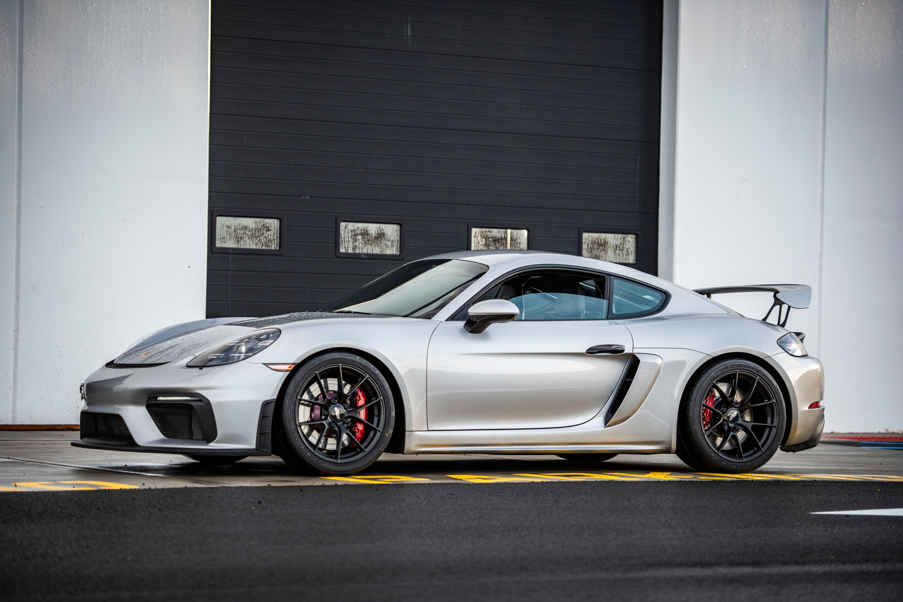Silver Porsche 718 Cayman GT4 with 19" VS-5RS Apex wheels in Satin Black