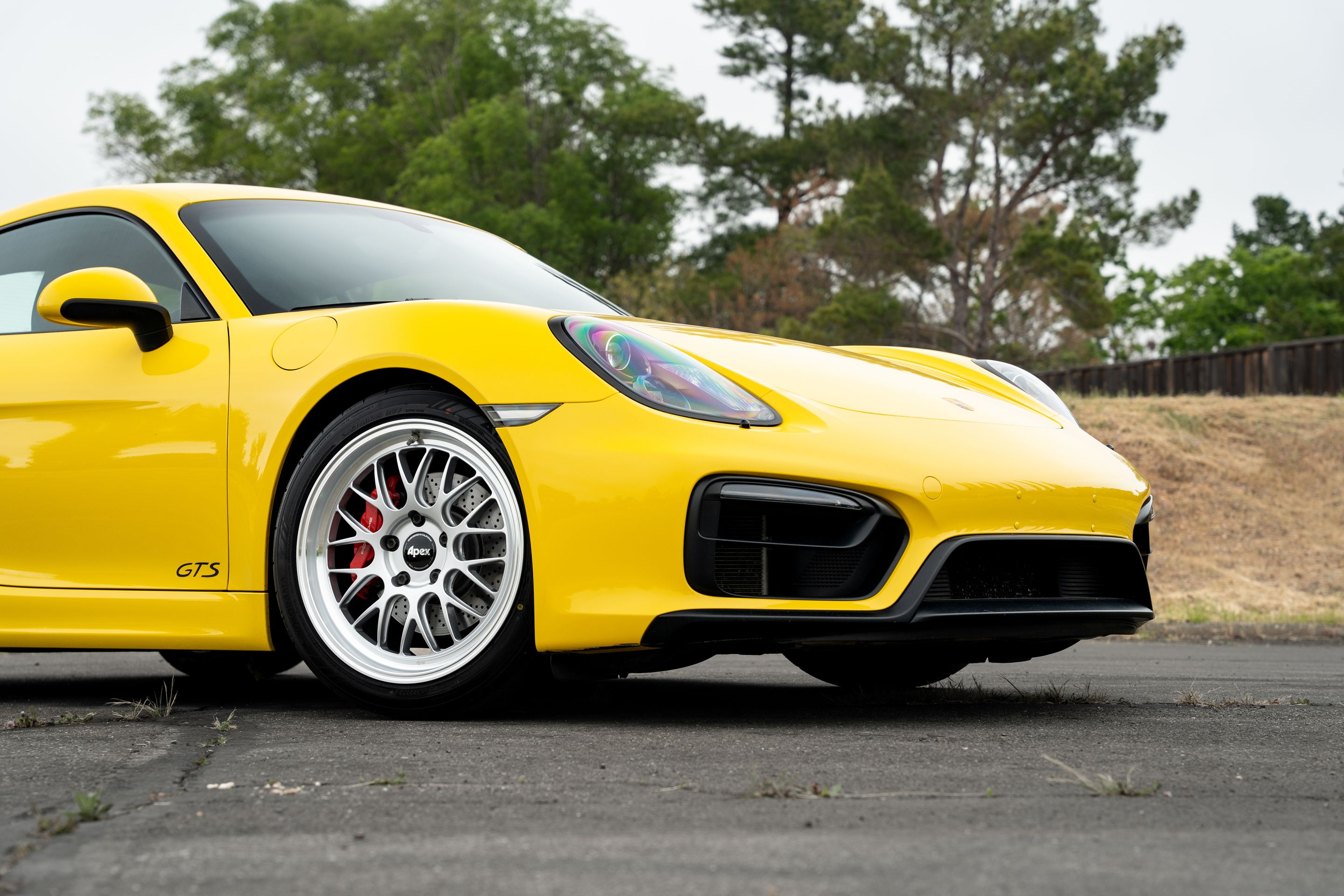 Yellow Porsche 981 Cayman GTS with 19" ML-10RT Apex wheels in Machined Lip Race Silver