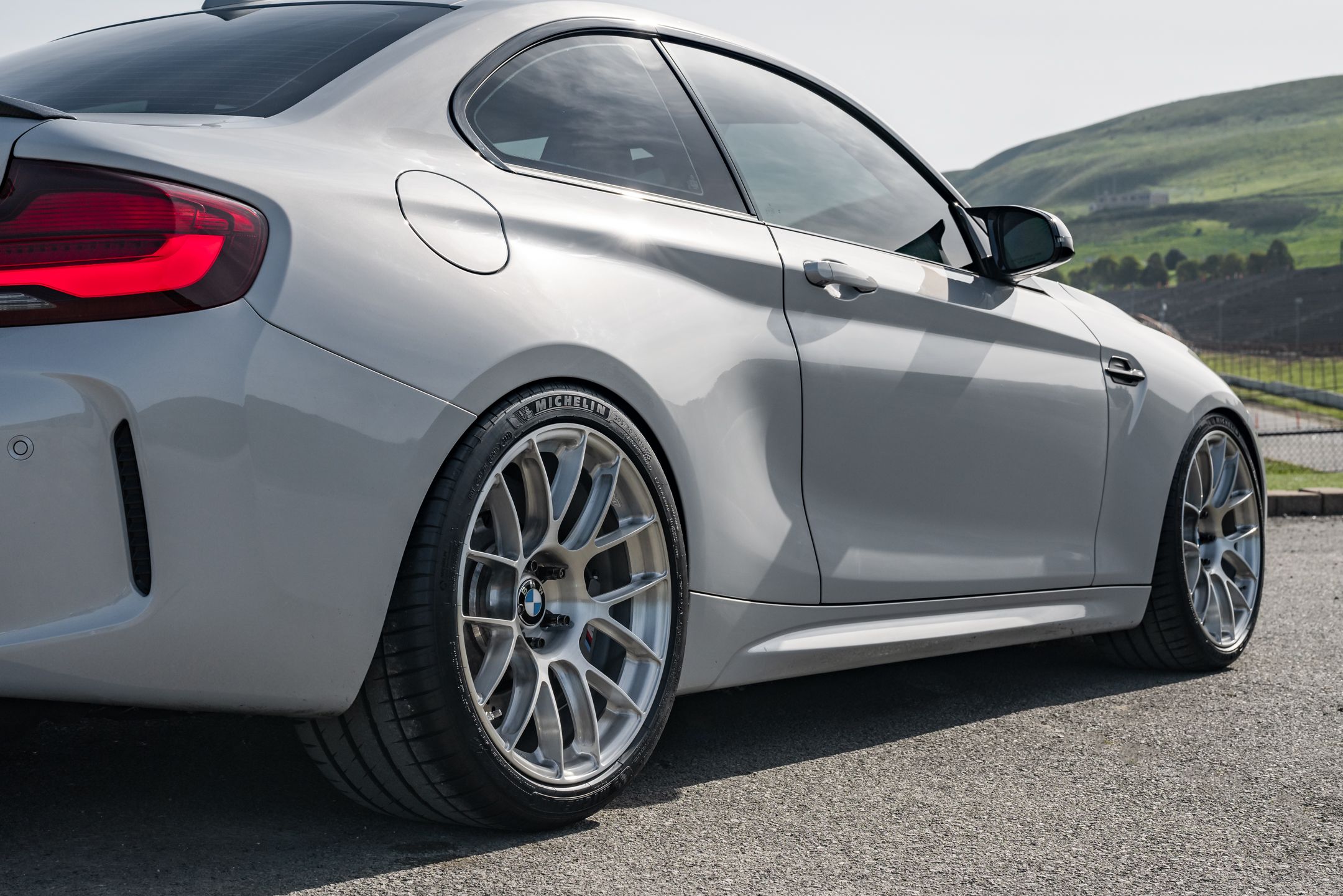 Silver BMW F87 M2 with 19" EC-7RS Apex wheels in Brushed Clear