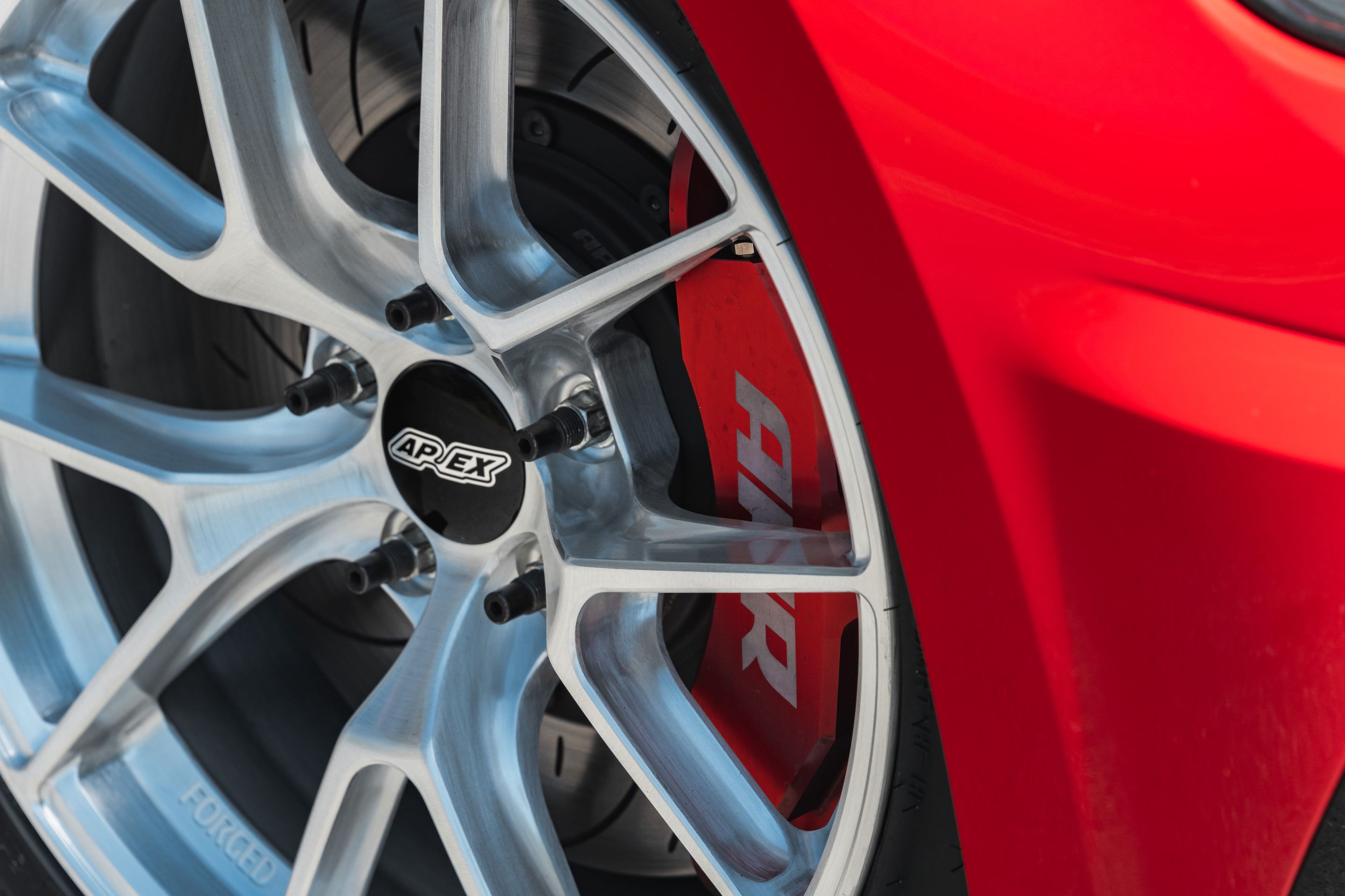 Red VW MK7 Alltrack/SportWagen Golf SportWagen with 17" VS-5RS Apex wheels in Brushed Clear