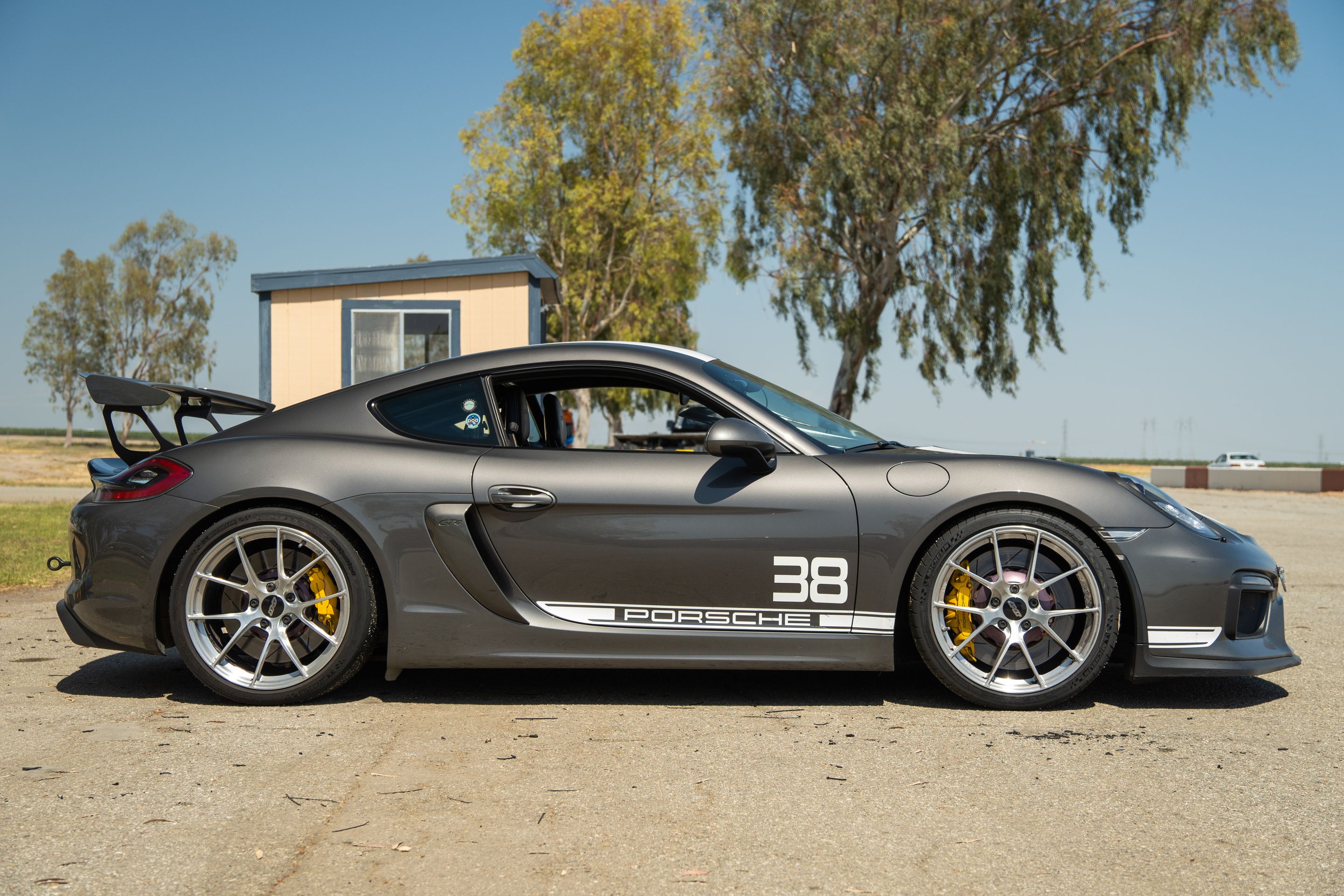 Grey Porsche 981 Cayman GT4 with 20" VS-5RS Apex wheels in Brushed Clear