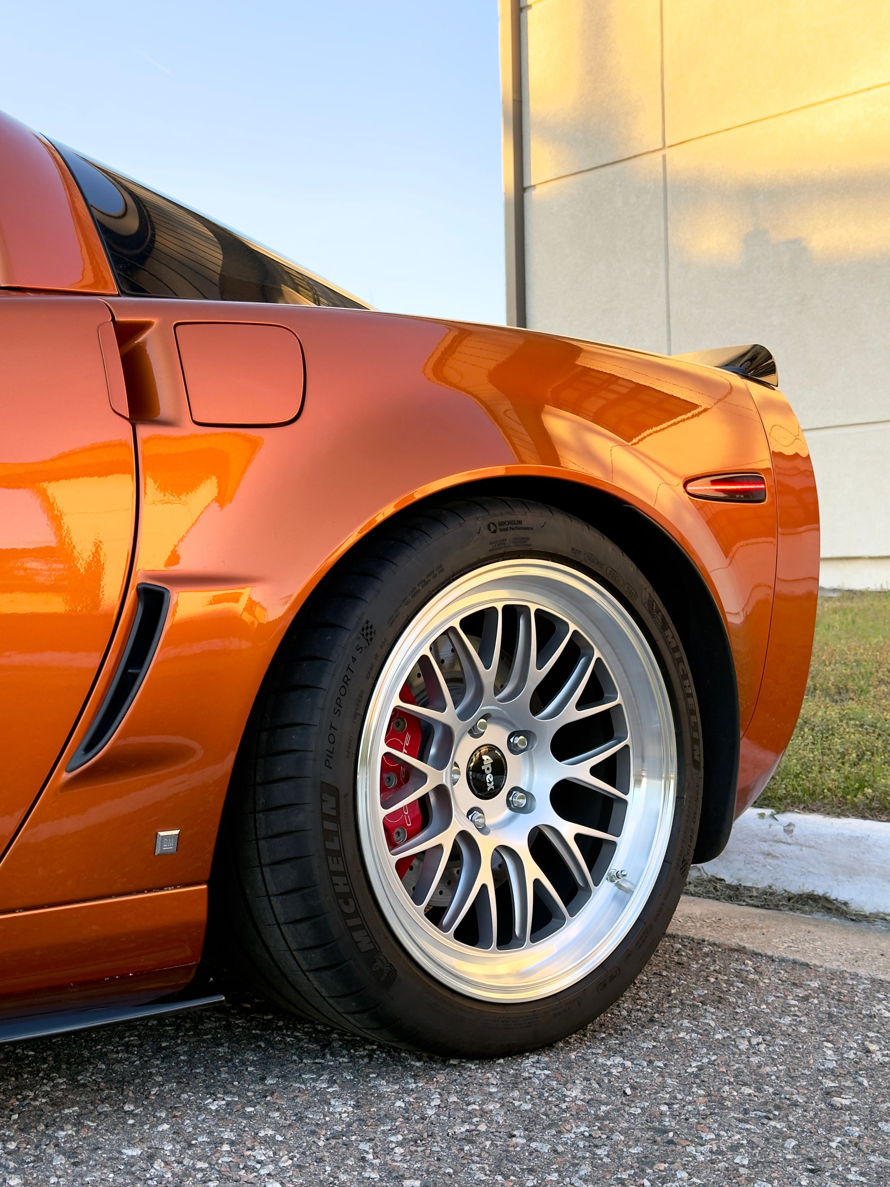 Orange Chevrolet C6 Corvette Z06 with 18"/19" ML-10RT Apex wheels in Machined Lip Race Silver