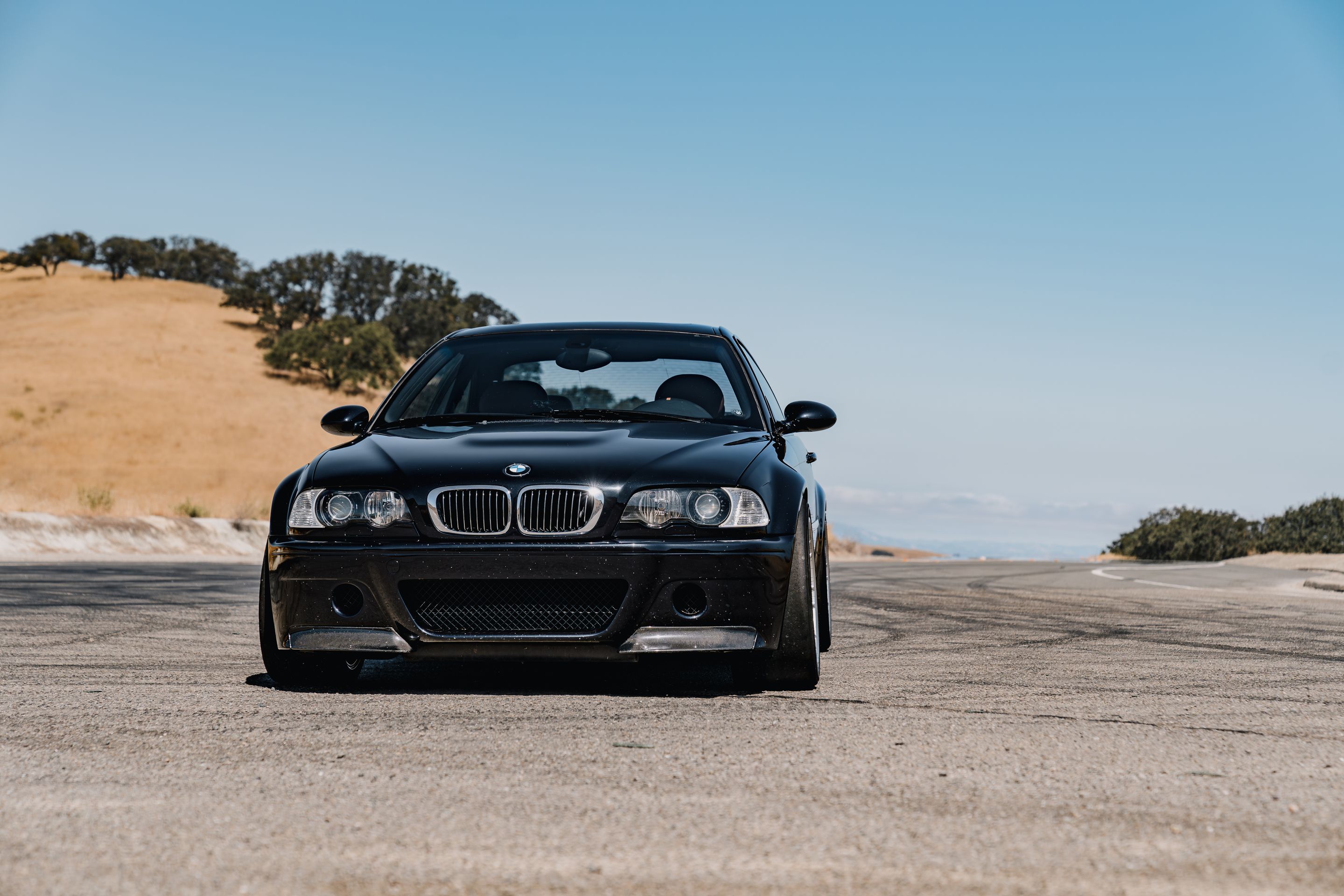 Black BMW E46 M3 with 18" ARC-8RT Apex wheels in Race Silver