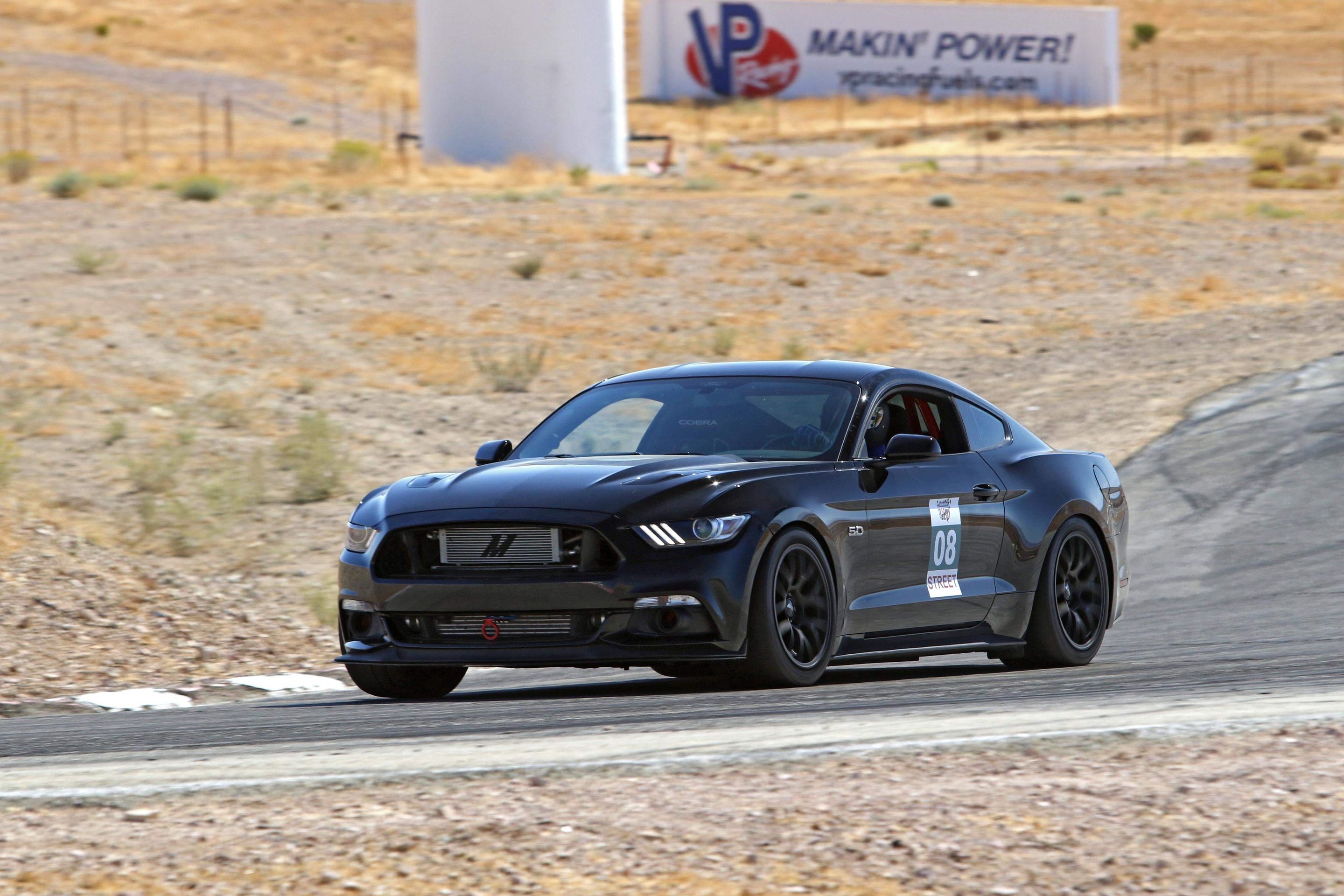 Black Ford S550 Mustang GT with 18" EC-7 Apex wheels in Satin Black