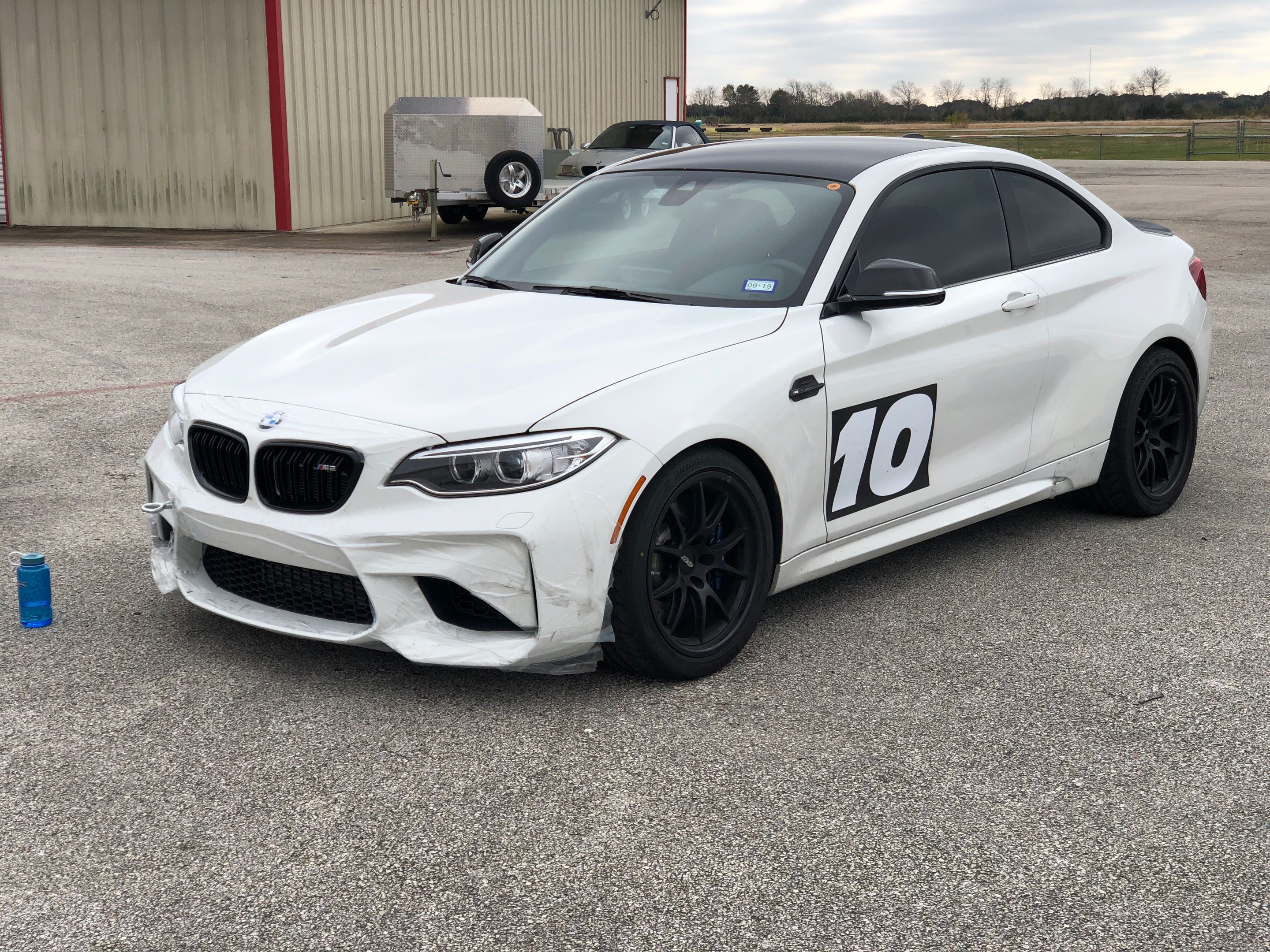 White BMW F87 M2 with 18" FL-5 Apex wheels in Satin Black