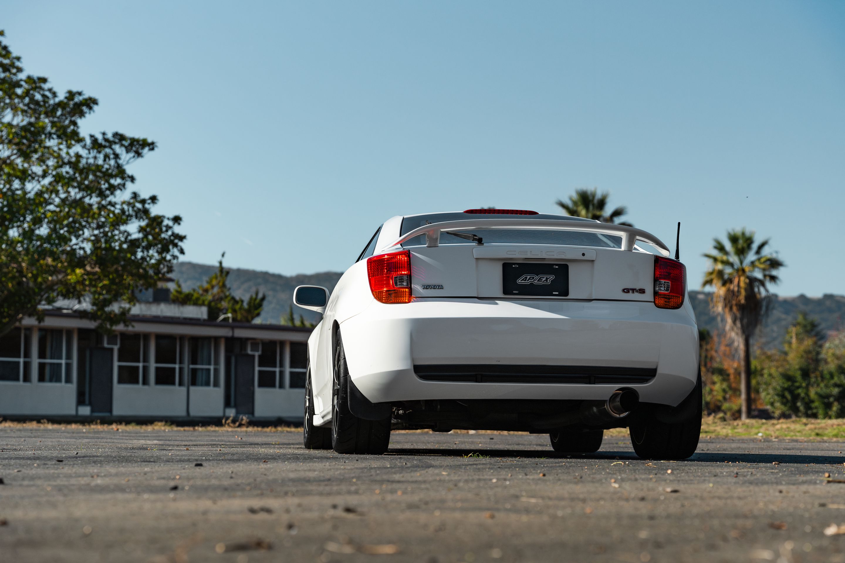 White Toyota 7th Gen Celica with 17" VS-5RS Apex wheels in Anthracite