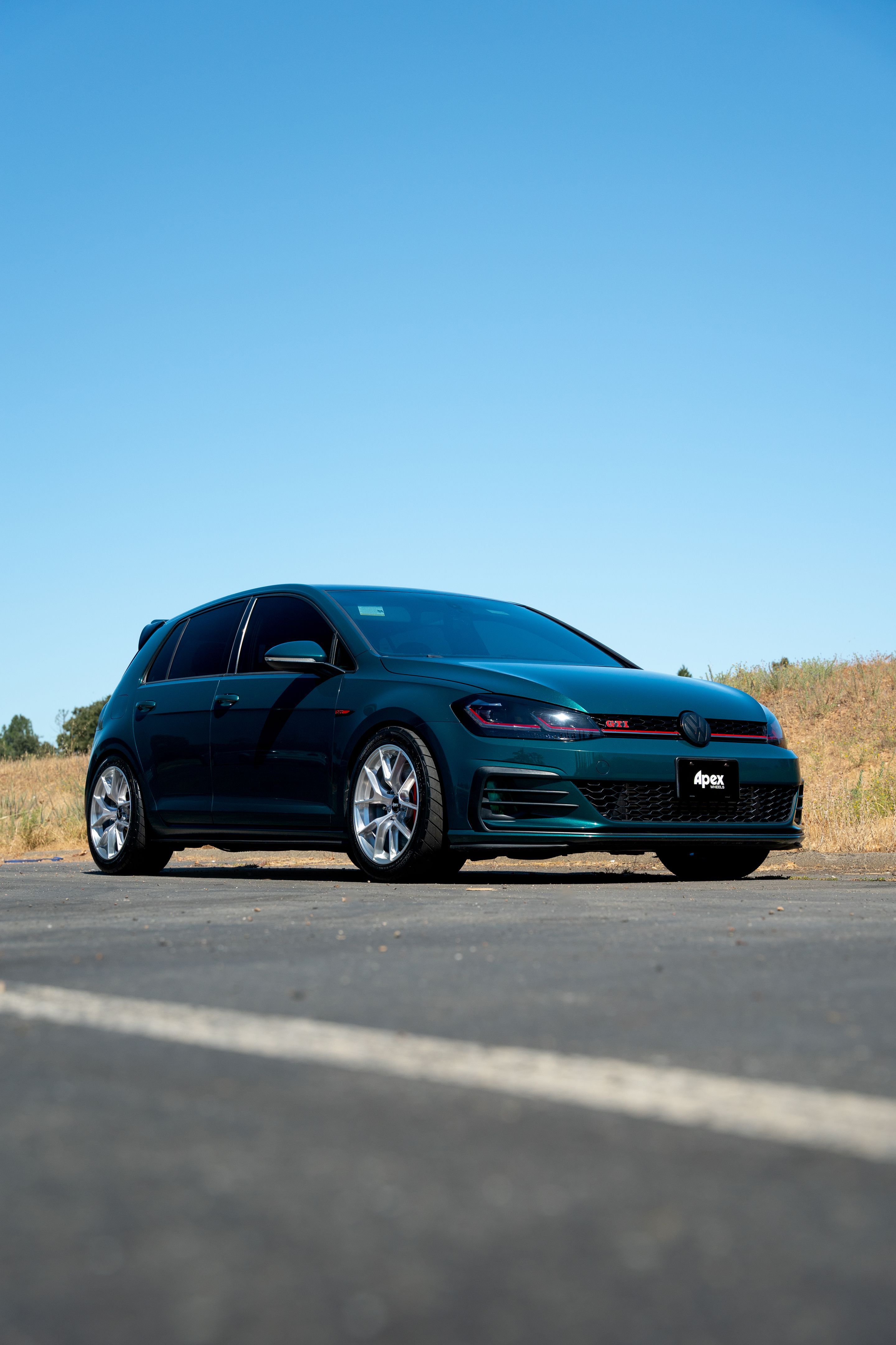 Green VW MK7 GTI with 17" VS-5RS Apex wheels in Brushed Clear