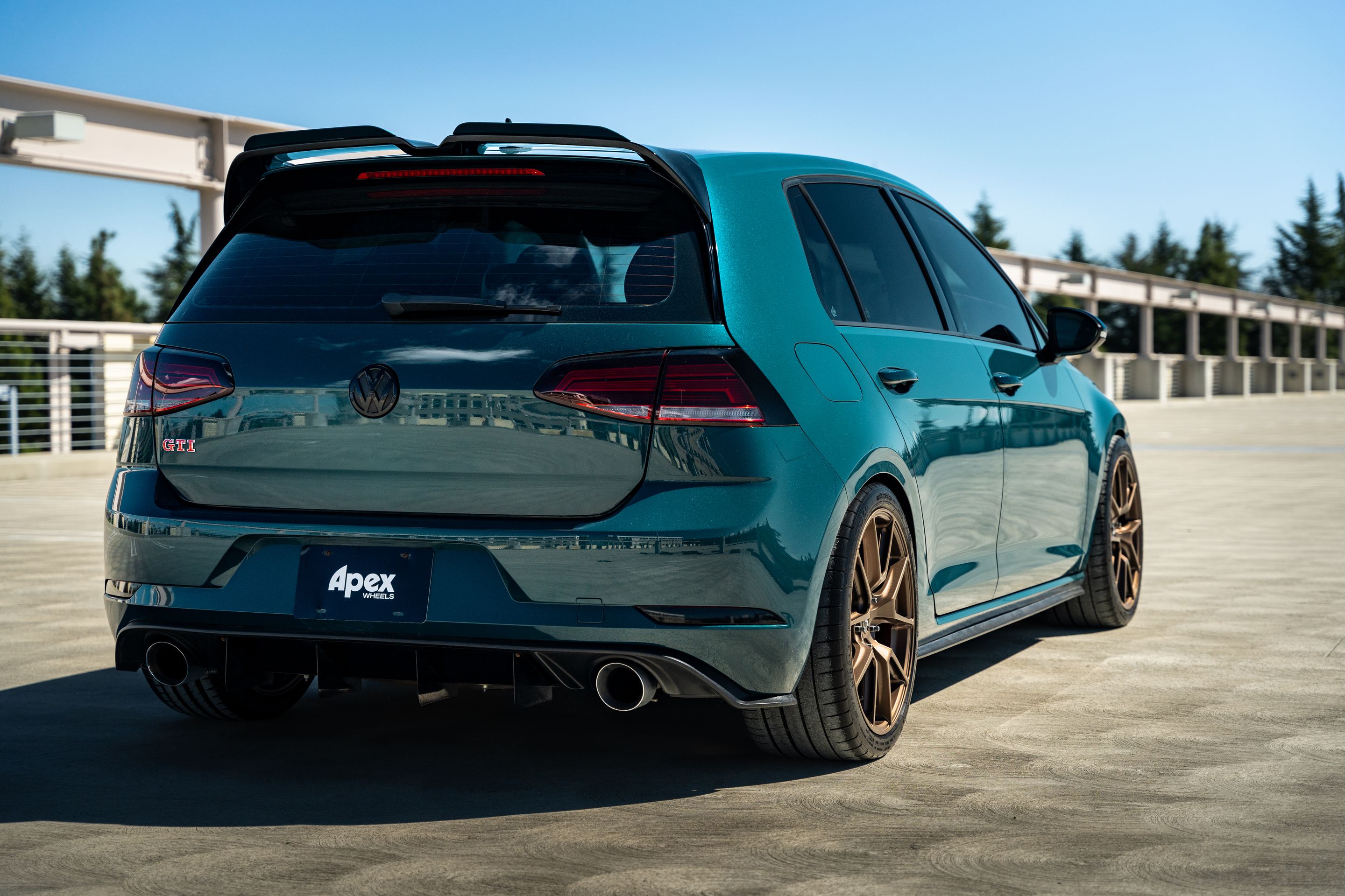 Green VW MK7 GTI with 18" VS-5 Apex wheels in Satin Bronze