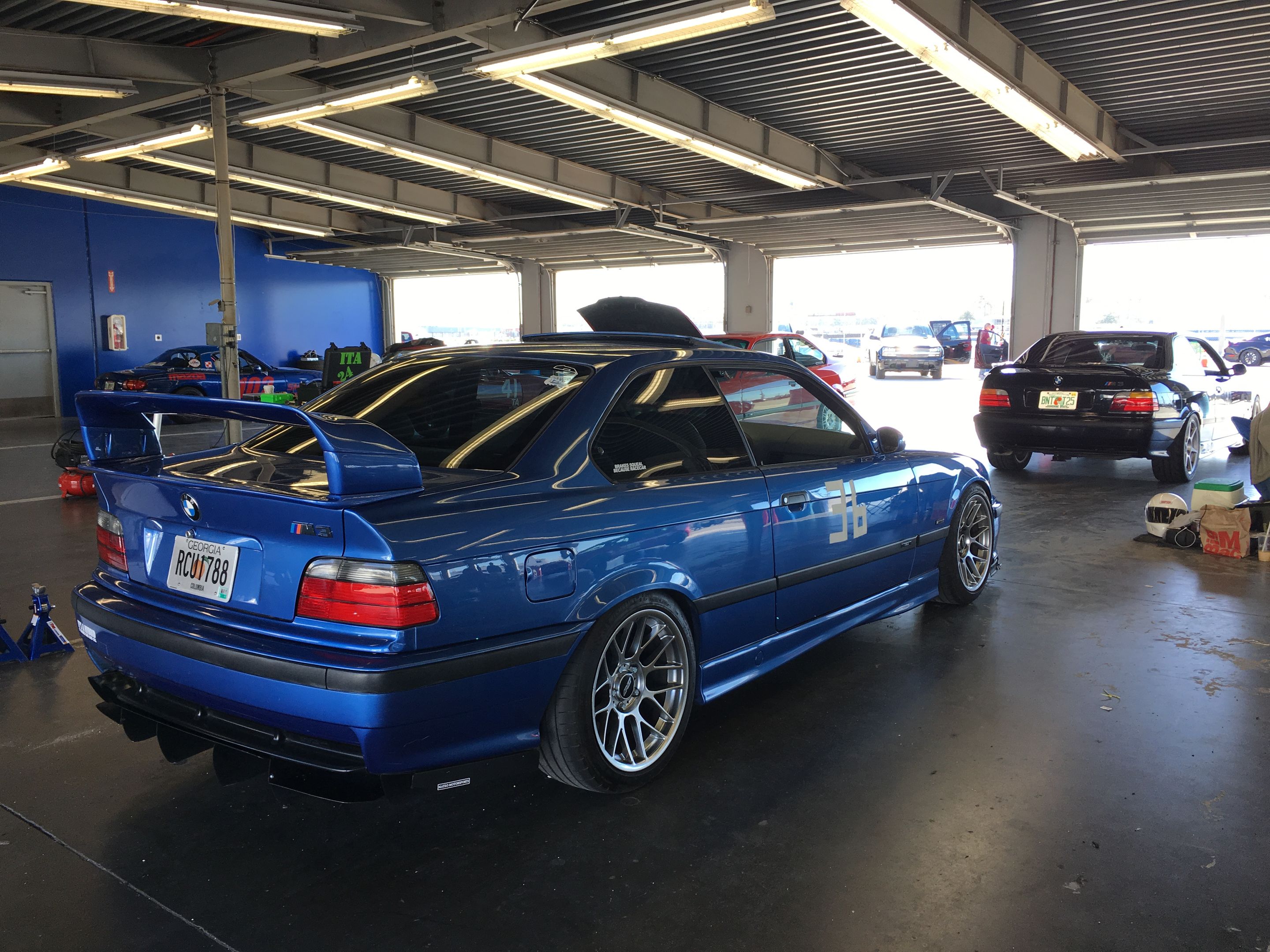 Blue BMW E36 M3 with 17" ARC-8 Apex wheels in Hyper Black
