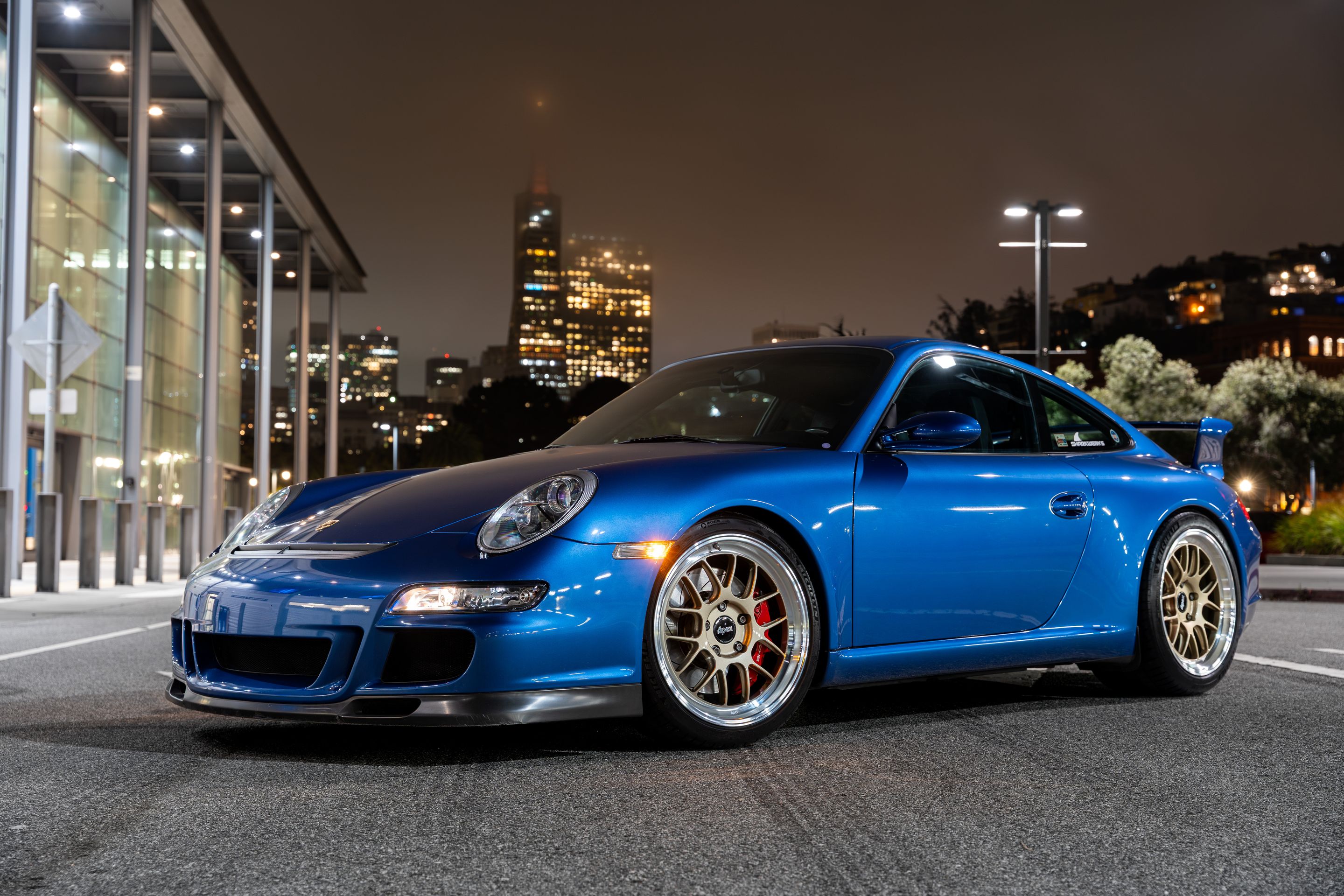 Blue Porsche 911 997 GT3 with 19" TEST-M Apex wheels in Machined Lip Gloss Motorsport Gold