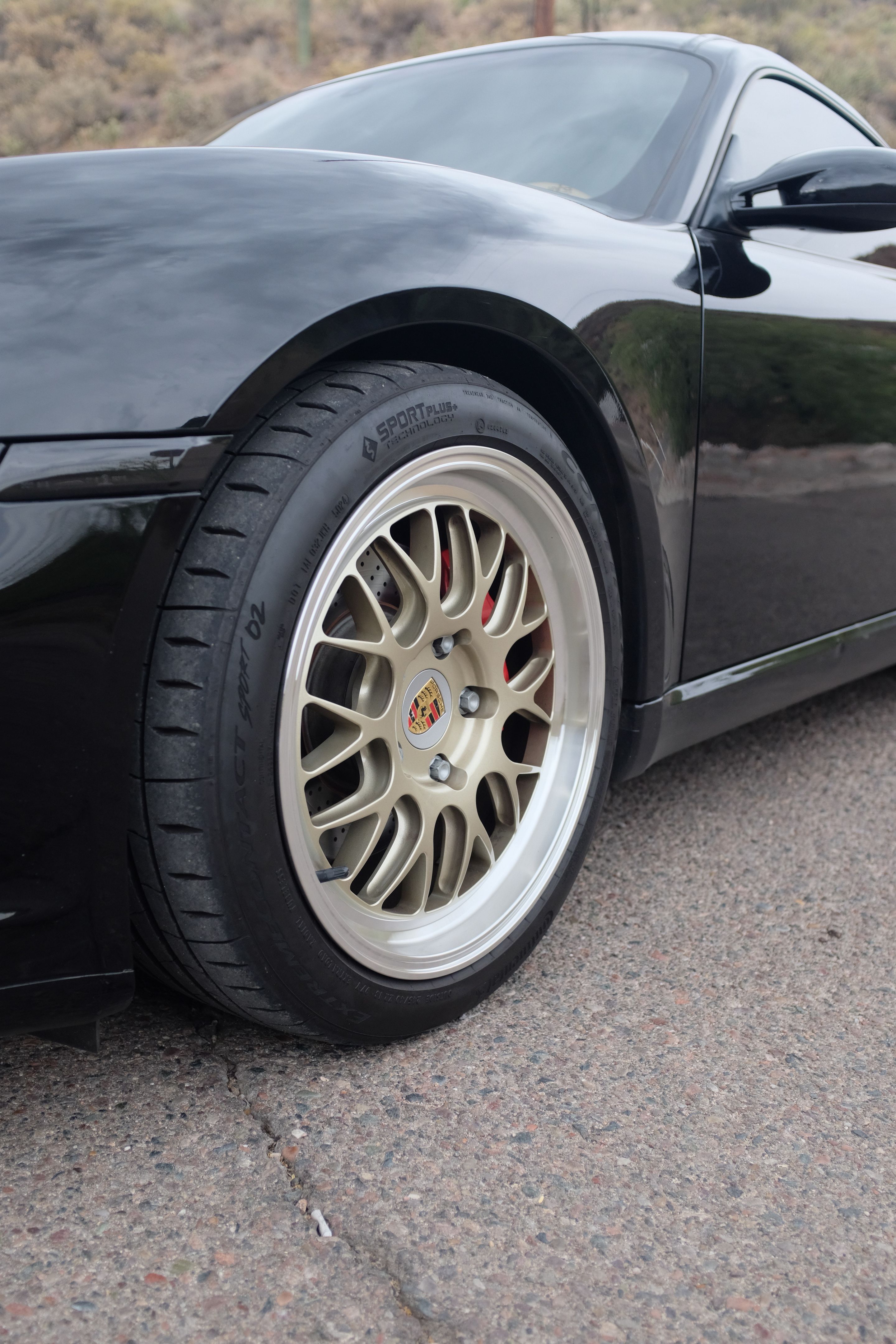 Black Porsche 987 Cayman S with 18" ML-10RT Apex wheels in Machined Lip Gloss Motorsport Gold