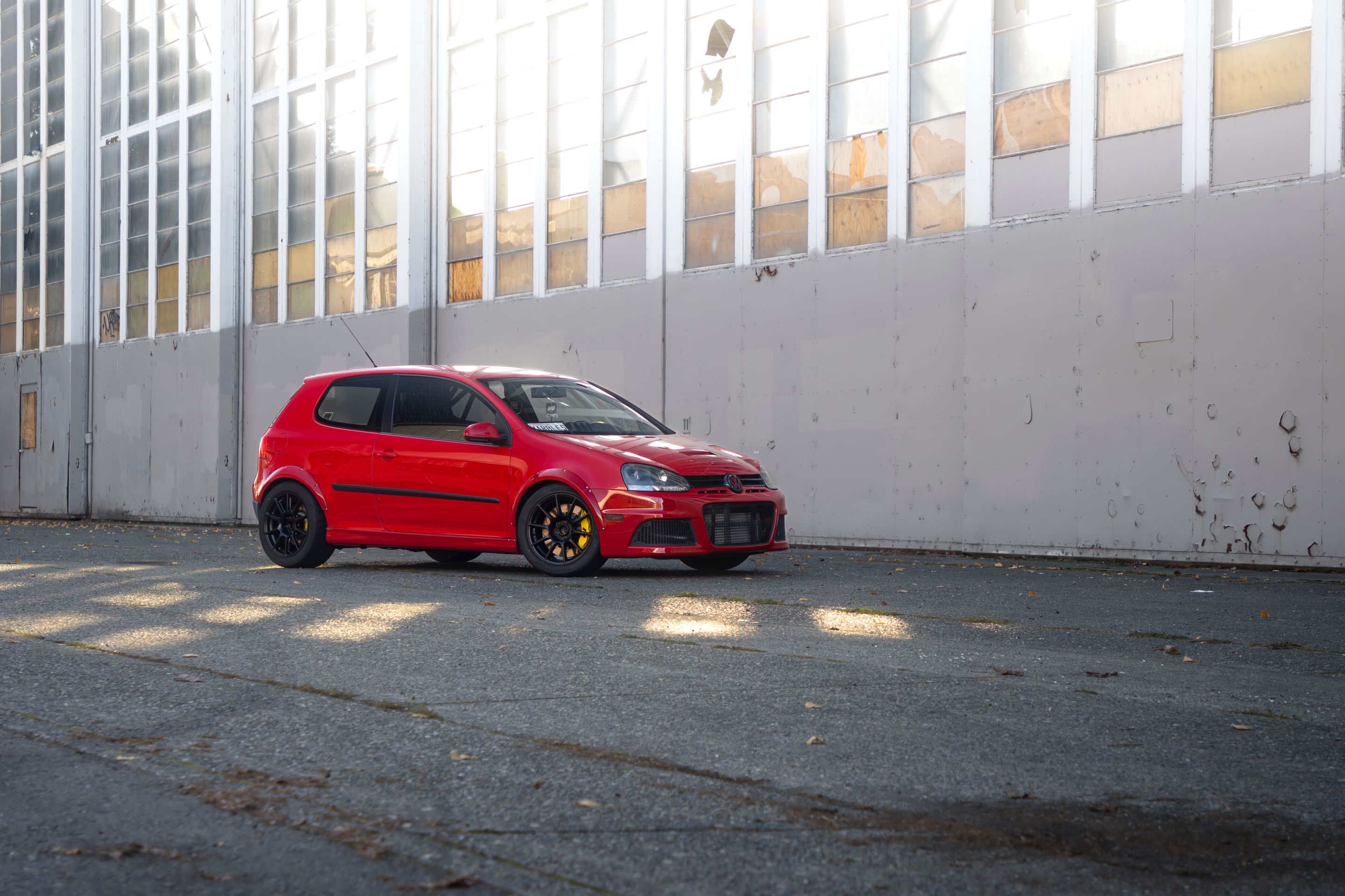 Red VW MK5 Golf with 17" SM-10 Apex wheels in Satin Black