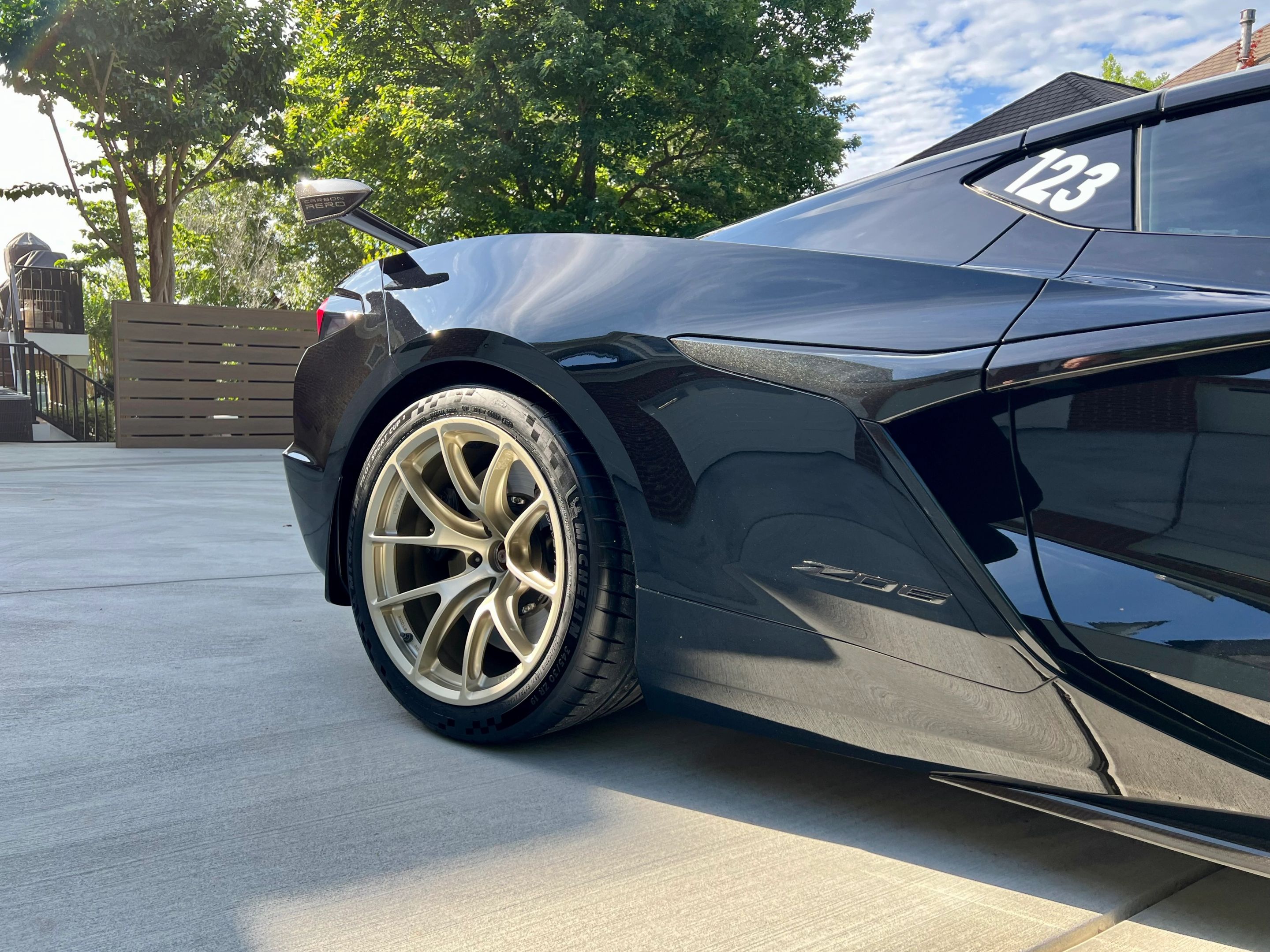 Black Chevrolet C8 Corvette Z06 with 19" VS-5RE Apex wheels in Motorsport Gold