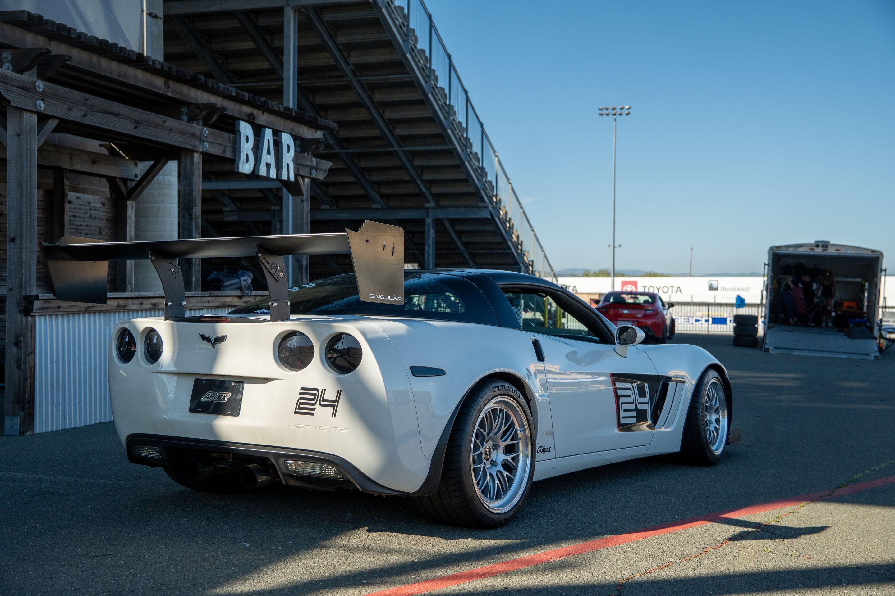 White Chevrolet C6 Corvette Grand Sport with 18"/19" ML-10RT Apex wheels in Machined Lip Race Silver