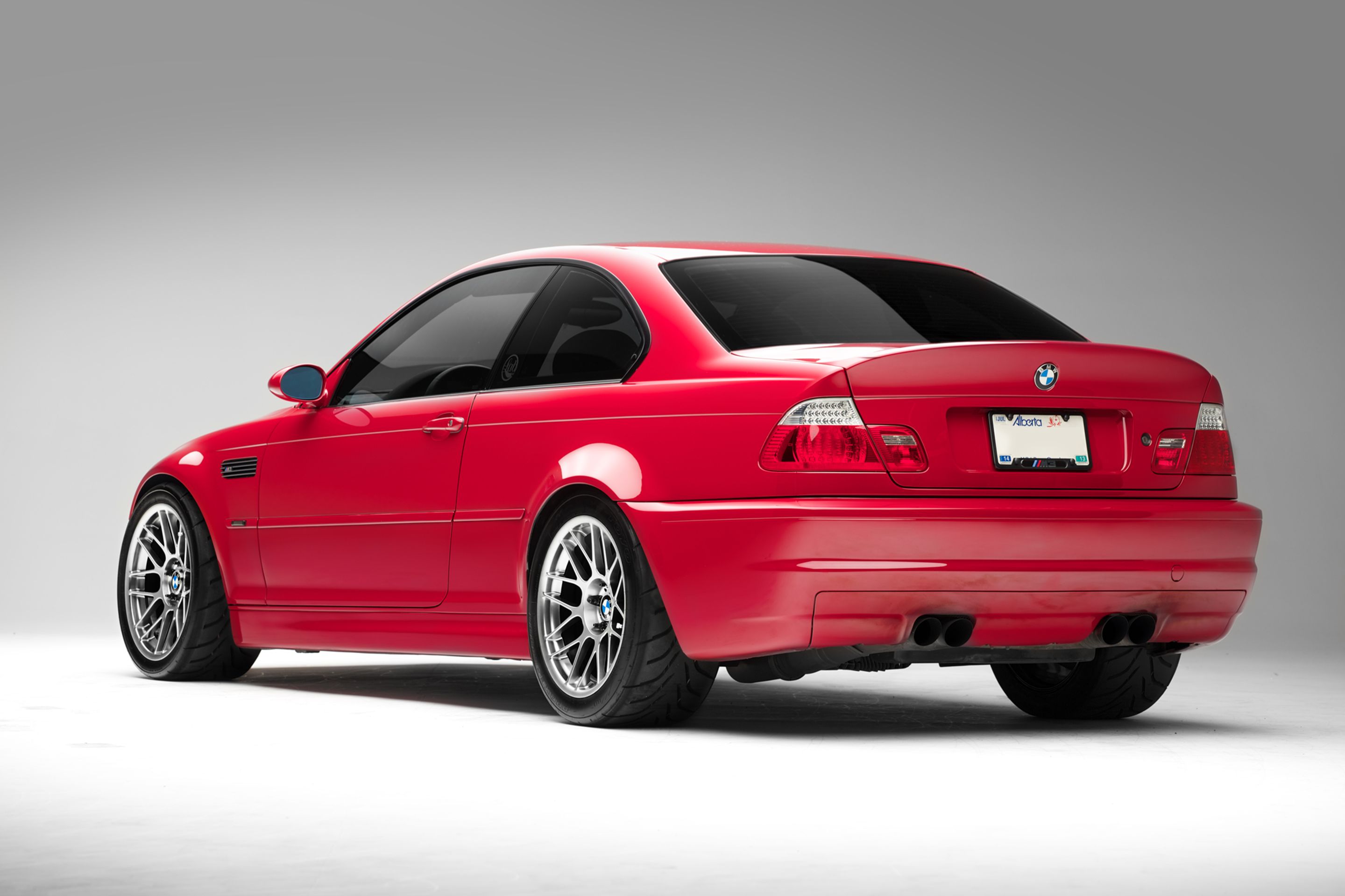 Red BMW E46 M3 with 18" ARC-8 Apex wheels in Hyper Black