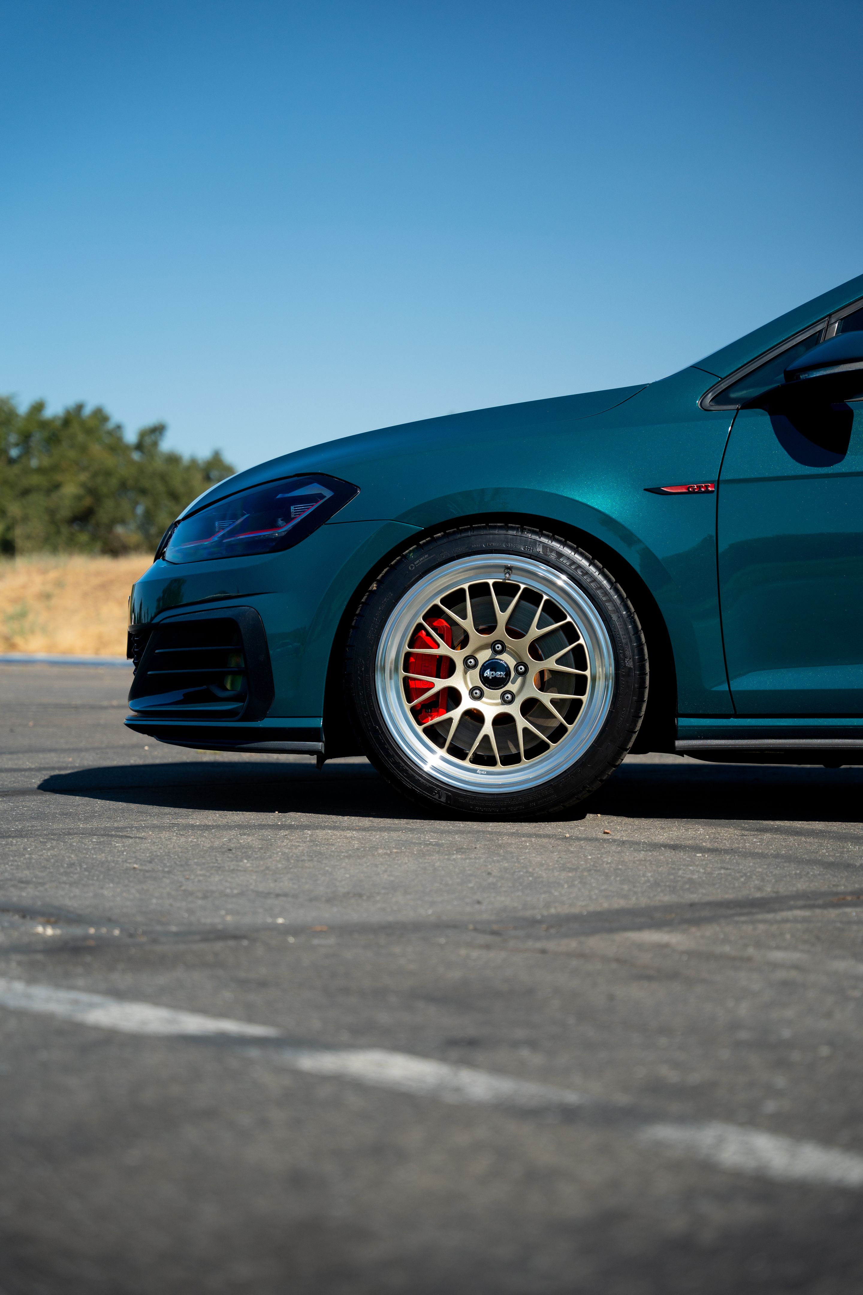 Green VW MK7 GTI with 18" ML-10RT Apex wheels in Machined Lip Gloss Motorsport Gold