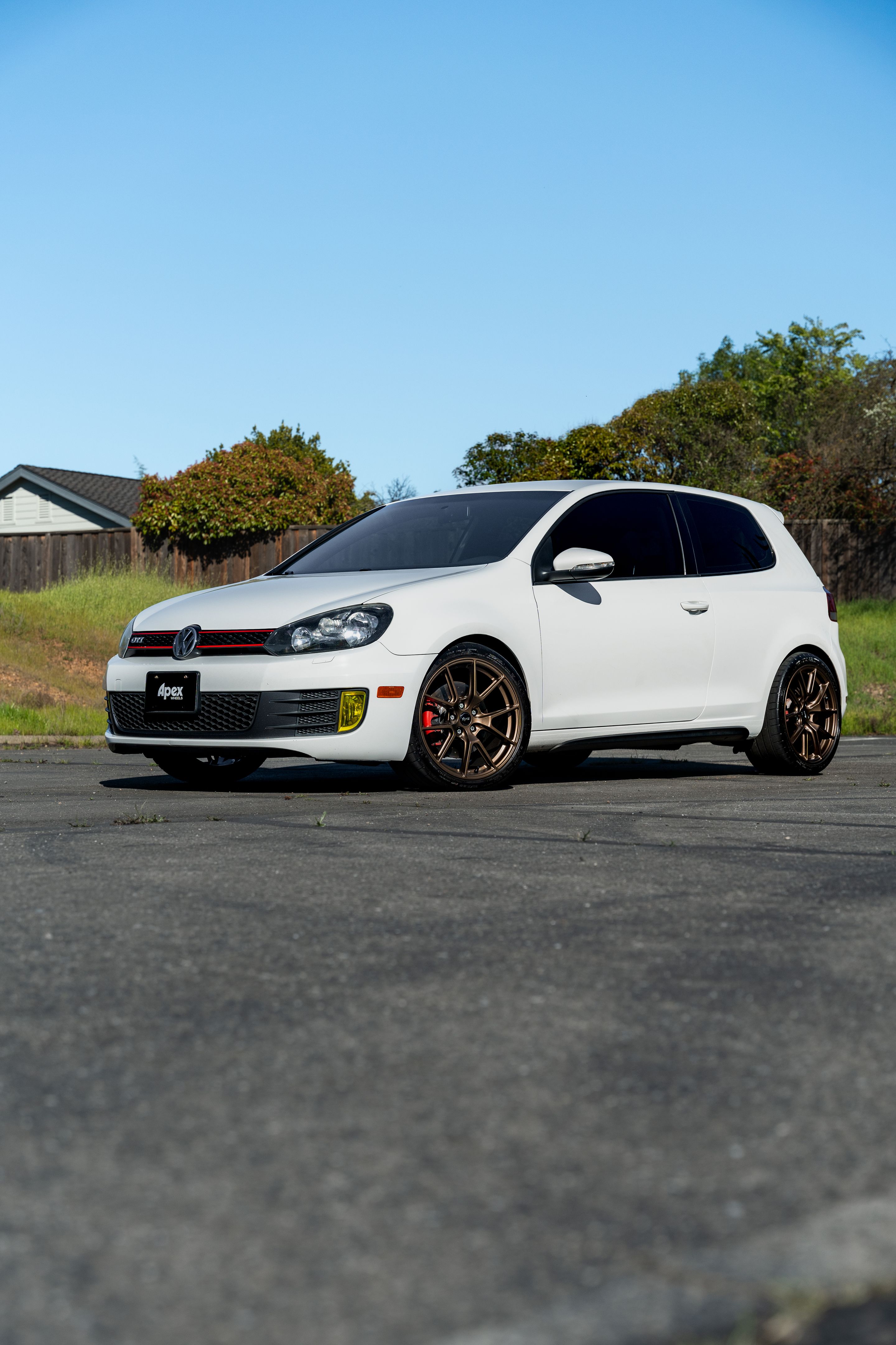White VW MK6 GTI with 18" VS-5 Apex wheels in Satin Bronze