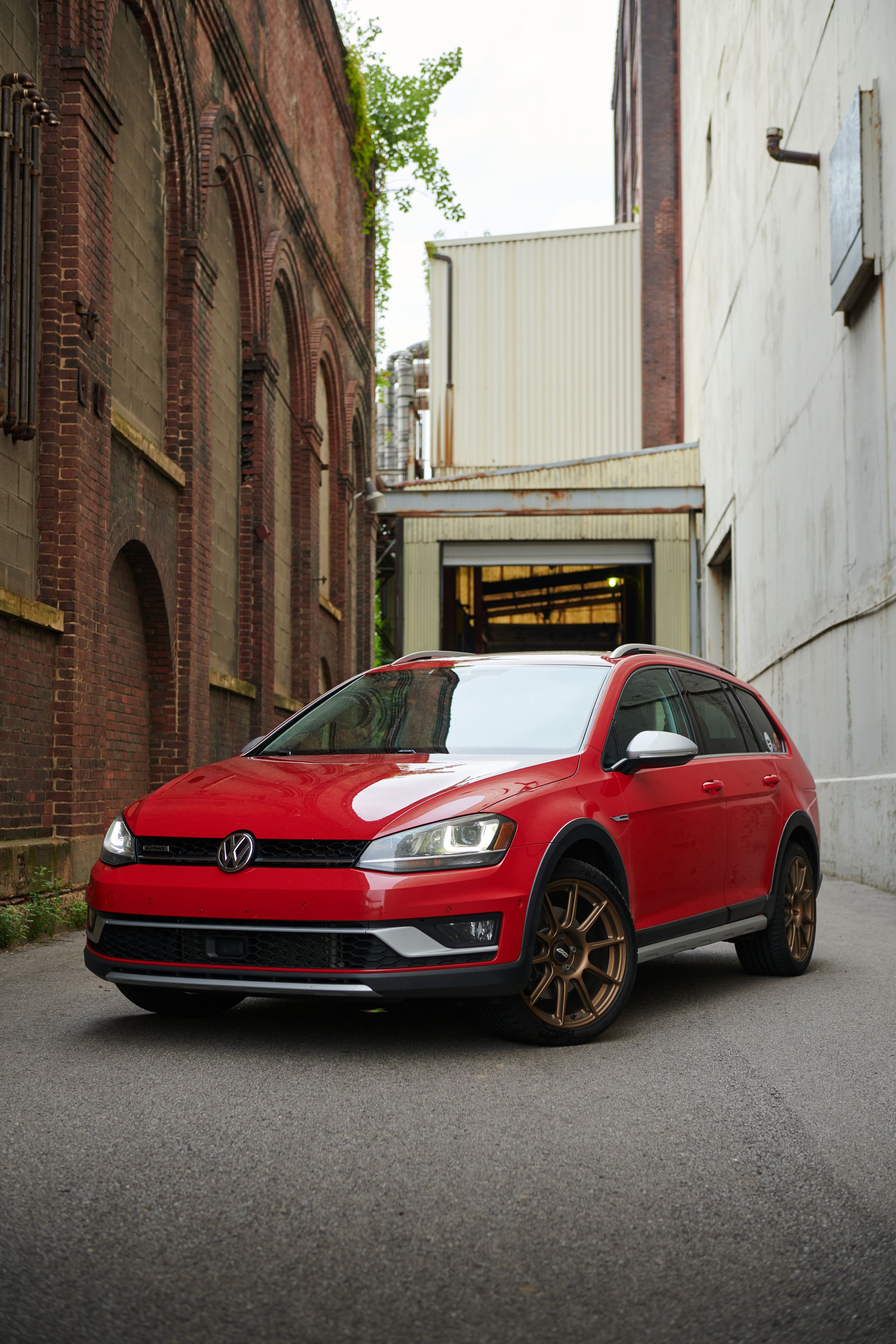 Red VW MK7 Alltrack/SportWagen Alltrack with 18" SM-10 Apex wheels in Satin Bronze