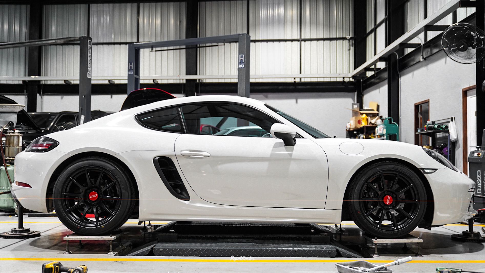 White Porsche 718 Cayman Base with 18" SM-10 Apex wheels in Satin Black
