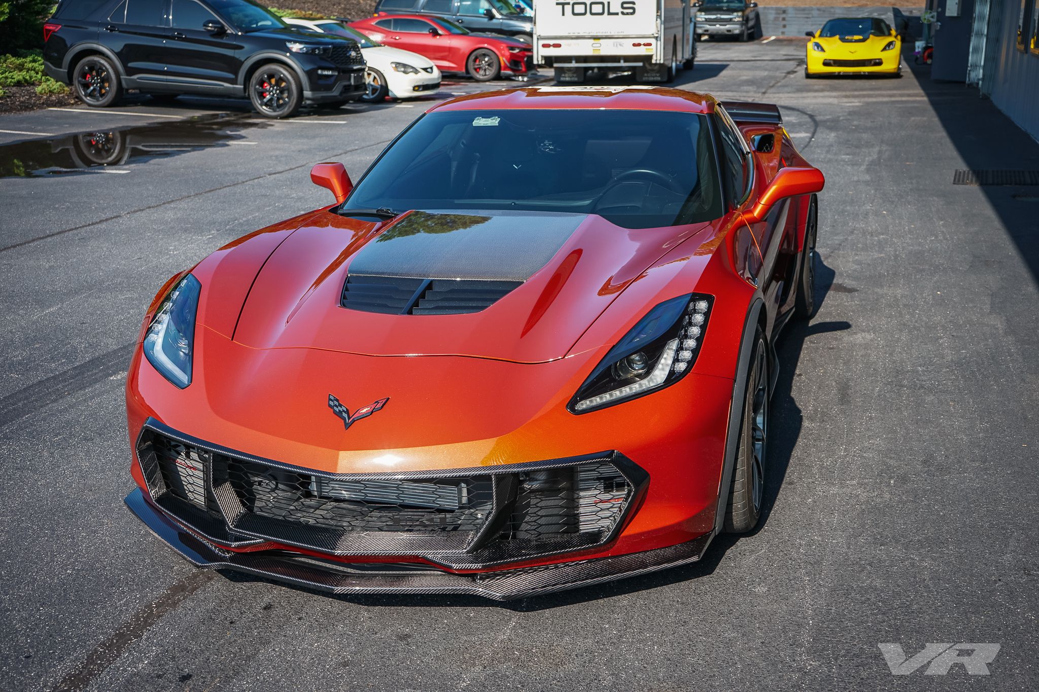 Orange Chevrolet C7 Corvette Z06 with 19"/18" VS-5RS Apex wheels in Anthracite